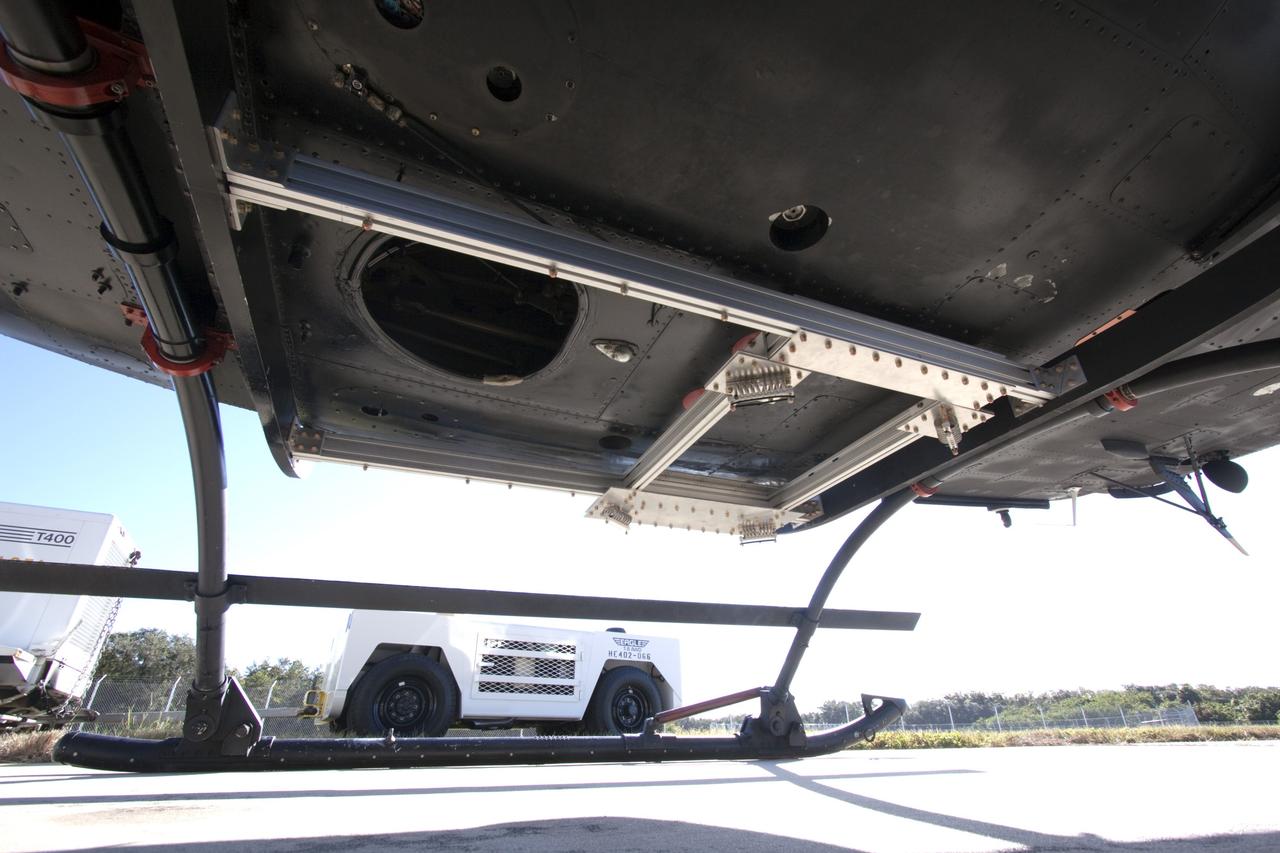 CAPE CANAVERAL, Fla. – Near the Shuttle Landing Facility at NASA's Kennedy Space Center in Florida, a space agency team installed and tested hazard avoidance instrumentation on a Huey helicopter. Led by the Johnson Space Center and supported by Jet Propulsion Laboratory and Langley Research Center, the Autonomous Landing Hazard Avoidance Technology, or ALHAT, laser system provides a planetary lander the ability to precisely land safely on a surface while detecting any dangerous obstacles such as rocks, holes and slopes. Just north of Kennedy's Shuttle Landing Facility runway, a rock- and crater-filled planetary scape has been built so engineers can test the ability to negotiate away from risks. Photo credit: NASA/Jim Grossmann