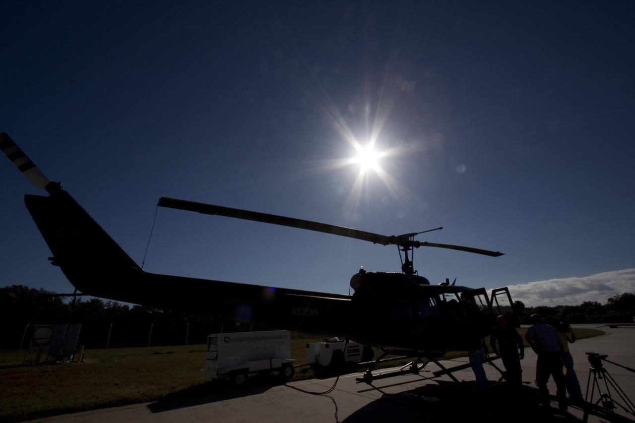 CAPE CANAVERAL, Fla. – Near the Shuttle Landing Facility at NASA's Kennedy Space Center in Florida, a space agency team installed and tested hazard avoidance instrumentation on a Huey helicopter. Led by the Johnson Space Center and supported by Jet Propulsion Laboratory and Langley Research Center, the Autonomous Landing Hazard Avoidance Technology, or ALHAT, laser system provides a planetary lander the ability to precisely land safely on a surface while detecting any dangerous obstacles such as rocks, holes and slopes. Just north of Kennedy's Shuttle Landing Facility runway, a rock- and crater-filled planetary scape has been built so engineers can test the ability to negotiate away from risks. Photo credit: NASA/Jim Grossmann