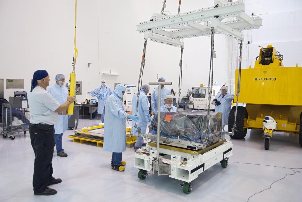 CAPE CANAVERAL, Fla. -- Workers inside the Space Station Processing Facility at NASA's Kennedy Space Center in Florida prepare to pack the orbital replacement unit for the space station's main bus switching unit in a shipping container.           The unit, which was processed at Kennedy, will be shipped to Japan at the beginning of the year for the HTV-4 launch, which is currently scheduled for 2013. Photo credit: NASA/Charisse Nahser