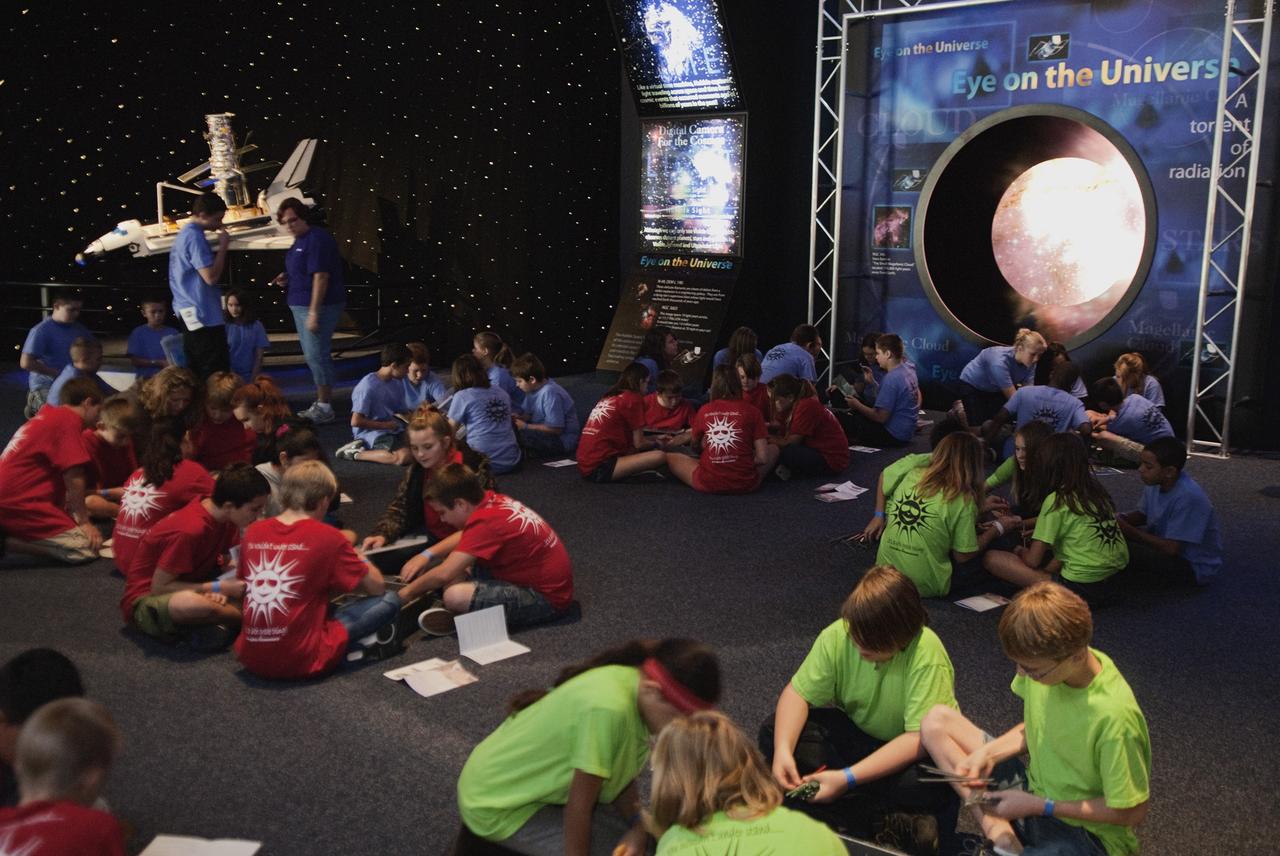 CAPE CANAVERAL, Fla. – At the Kennedy Space Center Visitor Complex in Florida teams of five students are using kits with identical plastic pieces to build a space station-like truss. Following construction, weights were added to determine its strength and points were awarded based on how much weight their truss would support. Between Nov. 26 and Dec. 7, 2012, about 5,300 sixth-graders in Brevard County, Florida were bused to Kennedy's Visitor Complex for Brevard Space Week, an educational program designed to encourage interest in science, technology, engineering and mathematics STEM careers. Photo credit: NASA/Tim Jacobs