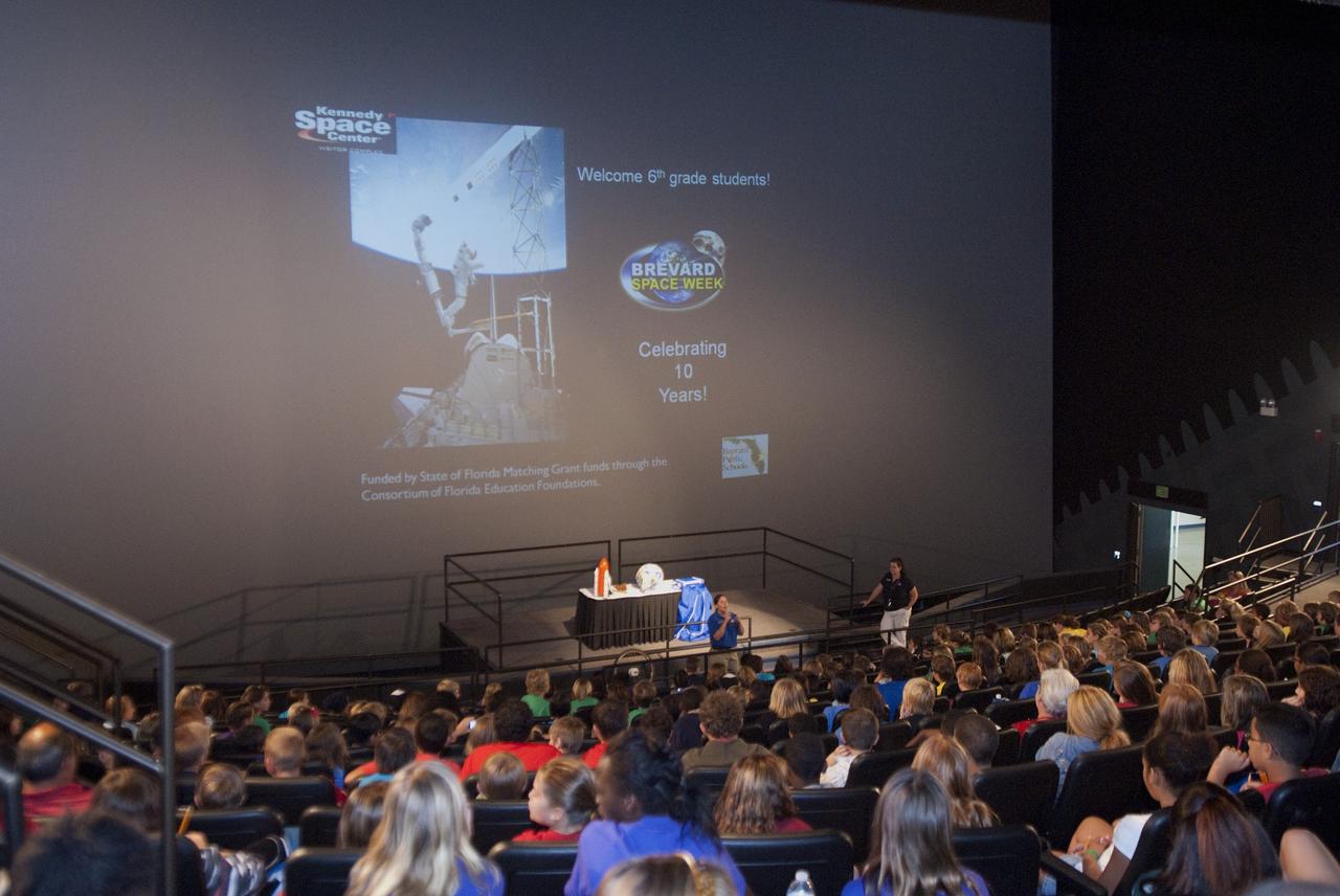 CAPE CANAVERAL, Fla. – At the Kennedy Space Center Visitor Complex in Florida sixth-grade students are welcomed to an interactive science demonstration by Kerri Lubeski, senior educator and coordinator of Brevard Space Week for Delaware North Companies Parks and Resorts. Between Nov. 26 and Dec. 7, 2012, about 5,300 sixth-graders in Brevard County, Florida were bused to Kennedy's Visitor Complex for Brevard Space Week, an educational program designed to encourage interest in science, technology, engineering and mathematics STEM careers. Photo credit: NASA/Tim Jacobs