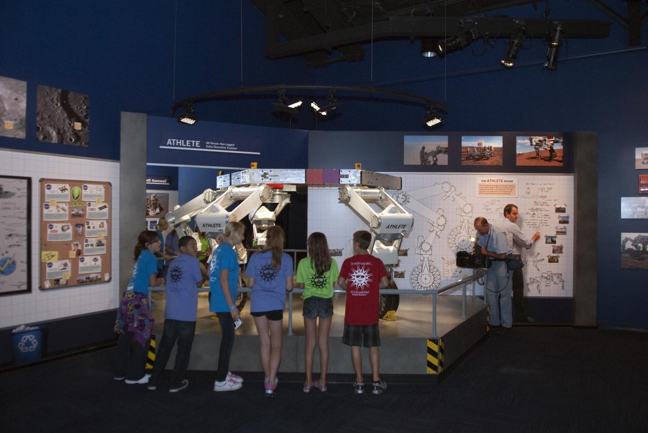 CAPE CANAVERAL, Fla. – At the Kennedy Space Center Visitor Complex in Florida sixth-grade students view a mock-up of a robotic device that could one day be sent to a distant planet.      Between Nov. 26 and Dec. 7, 2012, about 5,300 sixth-graders in Brevard County, Florida were bused to Kennedy's Visitor Complex for Brevard Space Week, an educational program designed to encourage interest in science, technology, engineering and mathematics STEM careers. Photo credit: NASA/Tim Jacobs