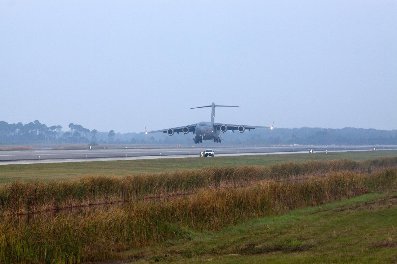 CAPE CANAVERAL, Fla. -- The Tracking and Data Relay Satellite known as TDRS-K arrives at NASA's Kennedy Space Center in Florida aboard an Air Force C-17 transport aircraft at 8:29 a.m. Dec. 18 at the agency's Kennedy Space Center in Florida in preparation for a Jan. 29 launch to a location in geostationary orbit. TDRS-K flew aboard a U.S. Air Force C-17 from the Boeing Space and Intelligence Systems assembly facility in El Segundo, Calif., for final preparation to launch aboard a United Launch Alliance Atlas V rocket. TDRS-K is the first of three next-generation satellites designed to ensure vital operational continuity for NASA by expanding the lifespan of the fleet. Each of the new satellites has a higher performance solar panel design to provide more spacecraft power. This upgrade will return signal processing for the S-Band multiple access service to the ground -- the same as the first-generation TDRS spacecraft. Ground-based processing allows TDRS to service more customers with different and evolving communication requirements. For more information, visit http://tdrs.gsfc.nasa.gov/ Photo credit: NASA/Kim Shiflett