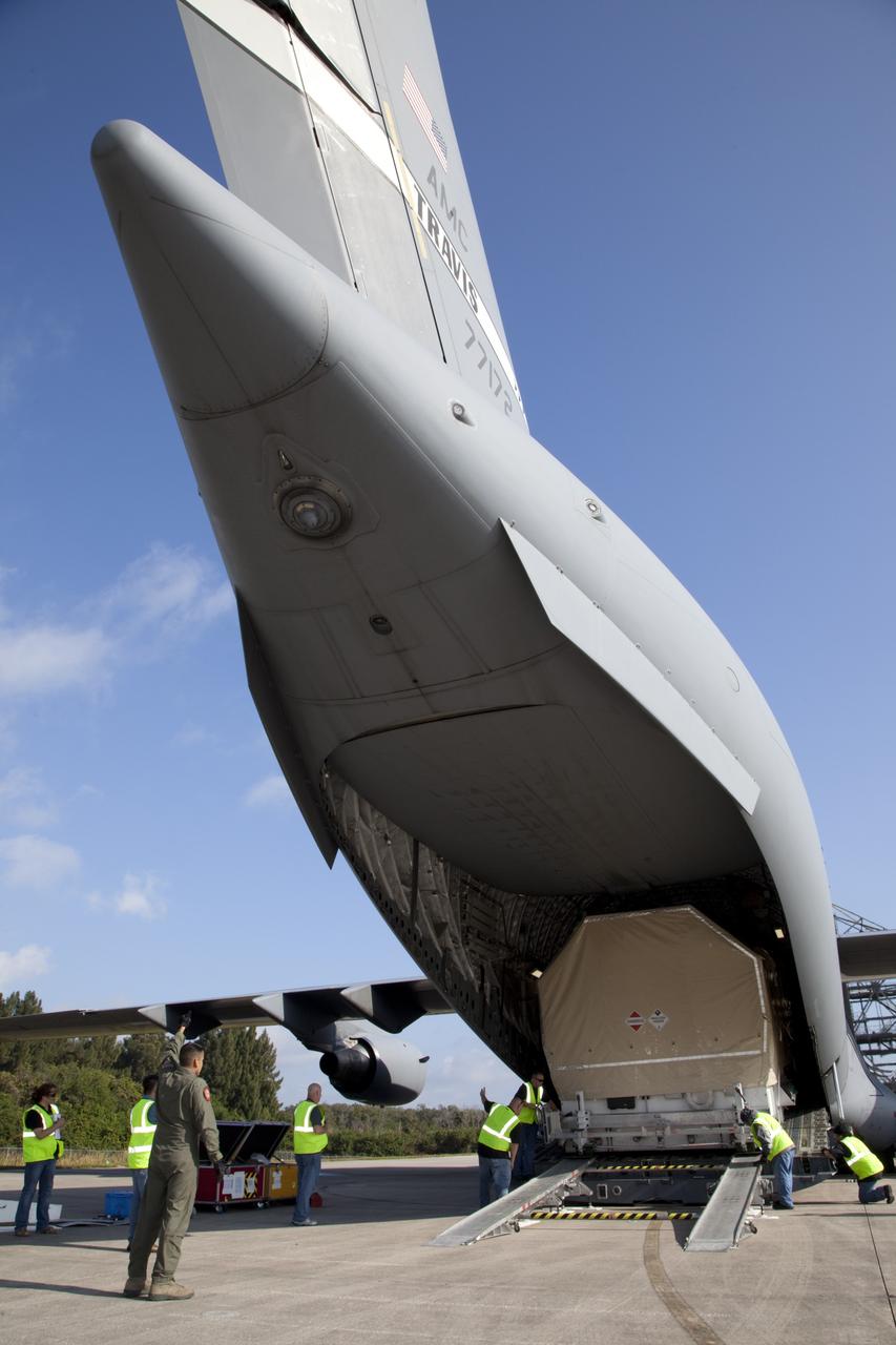 CAPE CANAVERAL, Fla. -- The Tracking and Data Relay Satellite known as TDRS-K arrives at NASA's Kennedy Space Center in Florida aboard an Air Force C-17 transport aircraft at 8:29 a.m. Dec. 18 at the agency's Kennedy Space Center in Florida in preparation for a Jan. 29 launch to a location in geostationary orbit. TDRS-K flew aboard a U.S. Air Force C-17 from the Boeing Space and Intelligence Systems assembly facility in El Segundo, Calif., for final preparation to launch aboard a United Launch Alliance Atlas V rocket. TDRS-K is the first of three next-generation satellites designed to ensure vital operational continuity for NASA by expanding the lifespan of the fleet. Each of the new satellites has a higher performance solar panel design to provide more spacecraft power. This upgrade will return signal processing for the S-Band multiple access service to the ground -- the same as the first-generation TDRS spacecraft. Ground-based processing allows TDRS to service more customers with different and evolving communication requirements. For more information, visit http://tdrs.gsfc.nasa.gov/ Photo credit: NASA/Kim Shiflett