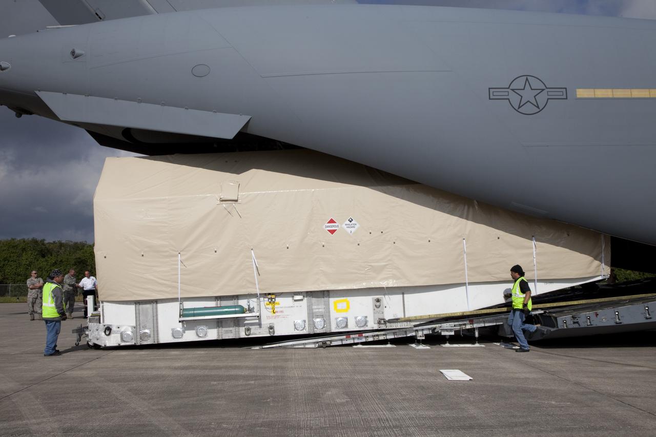 CAPE CANAVERAL, Fla. -- The Tracking and Data Relay Satellite known as TDRS-K arrives at NASA's Kennedy Space Center in Florida aboard an Air Force C-17 transport aircraft at 8:29 a.m. Dec. 18 at the agency's Kennedy Space Center in Florida in preparation for a Jan. 29 launch to a location in geostationary orbit. TDRS-K flew aboard a U.S. Air Force C-17 from the Boeing Space and Intelligence Systems assembly facility in El Segundo, Calif., for final preparation to launch aboard a United Launch Alliance Atlas V rocket. TDRS-K is the first of three next-generation satellites designed to ensure vital operational continuity for NASA by expanding the lifespan of the fleet. Each of the new satellites has a higher performance solar panel design to provide more spacecraft power. This upgrade will return signal processing for the S-Band multiple access service to the ground -- the same as the first-generation TDRS spacecraft. Ground-based processing allows TDRS to service more customers with different and evolving communication requirements. For more information, visit http://tdrs.gsfc.nasa.gov/ Photo credit: NASA/Kim Shiflett