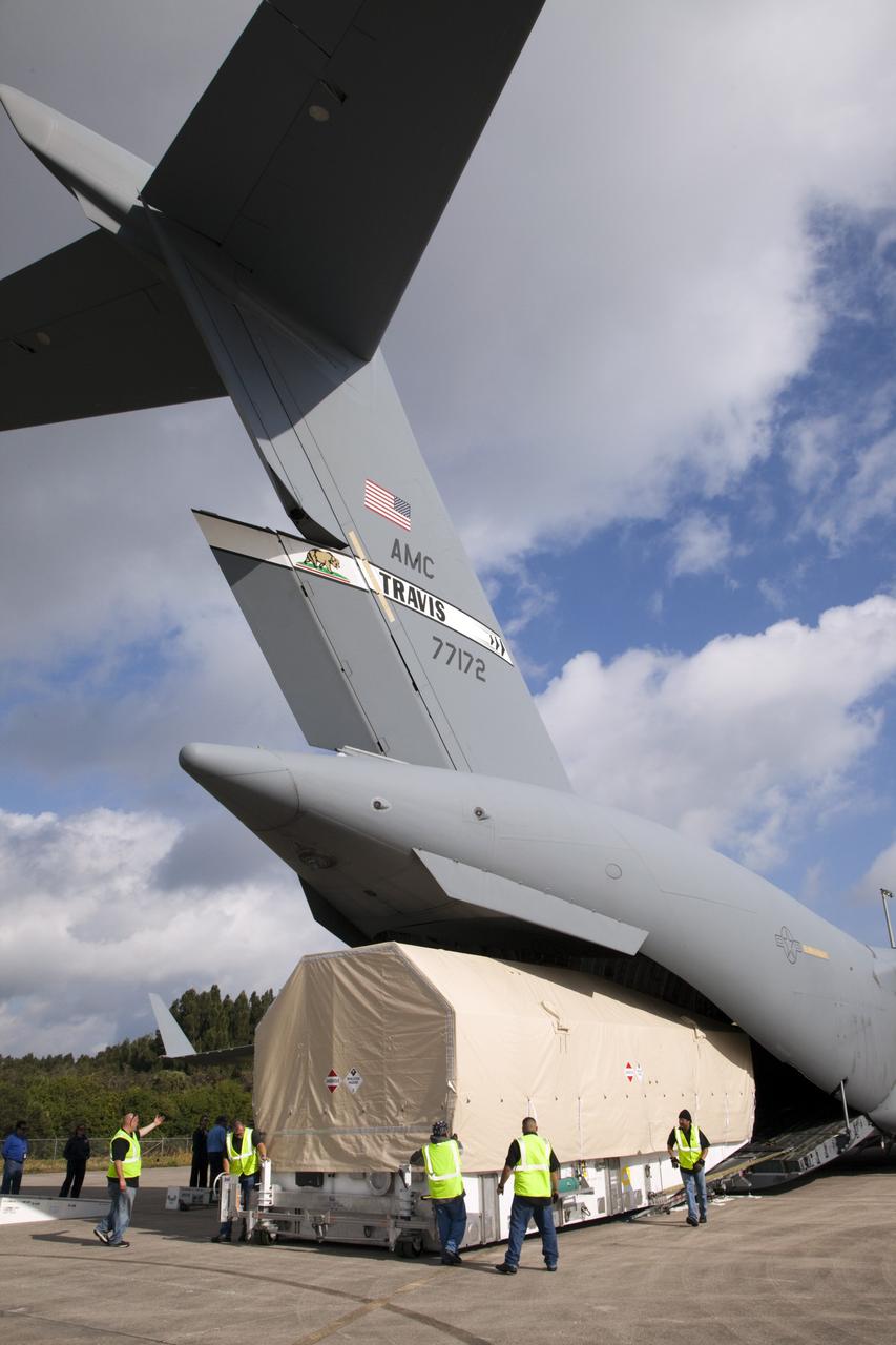 CAPE CANAVERAL, Fla. -- The Tracking and Data Relay Satellite known as TDRS-K arrives at NASA's Kennedy Space Center in Florida aboard an Air Force C-17 transport aircraft at 8:29 a.m. Dec. 18 at the agency's Kennedy Space Center in Florida in preparation for a Jan. 29 launch to a location in geostationary orbit. TDRS-K flew aboard a U.S. Air Force C-17 from the Boeing Space and Intelligence Systems assembly facility in El Segundo, Calif., for final preparation to launch aboard a United Launch Alliance Atlas V rocket. TDRS-K is the first of three next-generation satellites designed to ensure vital operational continuity for NASA by expanding the lifespan of the fleet. Each of the new satellites has a higher performance solar panel design to provide more spacecraft power. This upgrade will return signal processing for the S-Band multiple access service to the ground -- the same as the first-generation TDRS spacecraft. Ground-based processing allows TDRS to service more customers with different and evolving communication requirements. For more information, visit http://tdrs.gsfc.nasa.gov/ Photo credit: NASA/Kim Shiflett