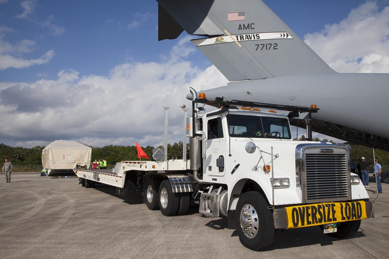 CAPE CANAVERAL, Fla. -- The Tracking and Data Relay Satellite known as TDRS-K arrives at NASA's Kennedy Space Center in Florida aboard an Air Force C-17 transport aircraft at 8:29 a.m. Dec. 18 at the agency's Kennedy Space Center in Florida in preparation for a Jan. 29 launch to a location in geostationary orbit. TDRS-K flew aboard a U.S. Air Force C-17 from the Boeing Space and Intelligence Systems assembly facility in El Segundo, Calif., for final preparation to launch aboard a United Launch Alliance Atlas V rocket. TDRS-K is the first of three next-generation satellites designed to ensure vital operational continuity for NASA by expanding the lifespan of the fleet. Each of the new satellites has a higher performance solar panel design to provide more spacecraft power. This upgrade will return signal processing for the S-Band multiple access service to the ground -- the same as the first-generation TDRS spacecraft. Ground-based processing allows TDRS to service more customers with different and evolving communication requirements. For more information, visit http://tdrs.gsfc.nasa.gov/ Photo credit: NASA/Kim Shiflett