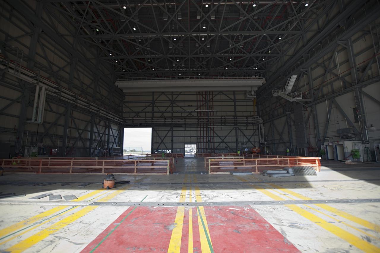 CAPE CANAVERAL, Fla. -- The Commercial Crew and Cargo Processing Facility, or C3PF, at NASA's Kennedy Space Center in Florida is going through major renovations to support the manufacturing of The Boeing Company's CST-100 spacecraft. Known throughout the space shuttle era as Orbiter Processing Facilty-3, or OPF-3, the facility's orbiter-specific platforms were removed recently to make room for a clean-floor factory-like facility. The modernization will allow Boeing to process its new fleet of low-Earth-orbit bound spacecraft, which is under development in collaboration with NASA's Commercial Crew Program, or CCP. Boeing is leasing the excess government facility for next-generation commercial activities through a land-use agreement with Space Florida.    To learn more about CCP and its industry partners, visit www.nasa.gov/commercialcrew. Photo credit: Dimitri Gerondidakis