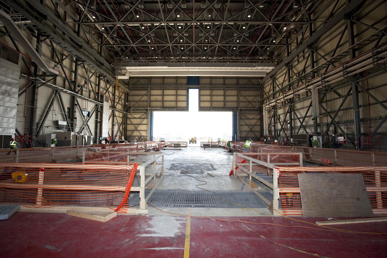 CAPE CANAVERAL, Fla. -- The Commercial Crew and Cargo Processing Facility, or C3PF, at NASA's Kennedy Space Center in Florida is going through major renovations to support the manufacturing of The Boeing Company's CST-100 spacecraft. Known throughout the space shuttle era as Orbiter Processing Facilty-3, or OPF-3, the facility's orbiter-specific platforms were removed recently to make room for a clean-floor factory-like facility. The modernization will allow Boeing to process its new fleet of low-Earth-orbit bound spacecraft, which is under development in collaboration with NASA's Commercial Crew Program, or CCP. Boeing is leasing the excess government facility for next-generation commercial activities through a land-use agreement with Space Florida.    To learn more about CCP and its industry partners, visit www.nasa.gov/commercialcrew. Photo credit: Dimitri Gerondidakis
