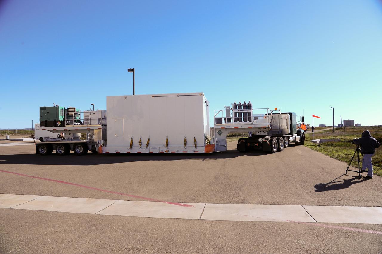 VANDENBERG AFB, Calif.-- NASA's Landsat Data Continuity Mission, or LDCM, satellite arrives by transport truck at Vandenberg Air Force Base, Calif. for prelaunch processing.      The Landsat Data Continuity Mission LDCM is the future of Landsat satellites. It will continue to obtain valuable data and imagery to be used in agriculture, education, business, science, and government. The Landsat Program provides repetitive acquisition of high resolution multispectral data of the Earth's surface on a global basis. The data from the Landsat spacecraft constitute the longest record of the Earth's continental surfaces as seen from space. It is a record unmatched in quality, detail, coverage, and value. Launch is planned for Feb. 11, 2013. For more information, visit: http://www.nasa.gov/mission_pages/landsat/main/index.html Photo credit: NASA
