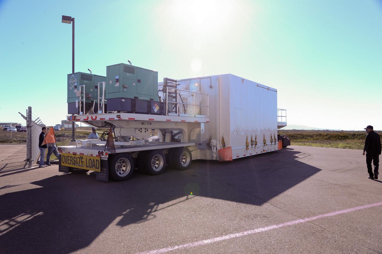 VANDENBERG AFB, Calif.-- NASA's Landsat Data Continuity Mission, or LDCM, satellite arrives by transport truck at Vandenberg Air Force Base, Calif. for prelaunch processing.      The Landsat Data Continuity Mission LDCM is the future of Landsat satellites. It will continue to obtain valuable data and imagery to be used in agriculture, education, business, science, and government. The Landsat Program provides repetitive acquisition of high resolution multispectral data of the Earth's surface on a global basis. The data from the Landsat spacecraft constitute the longest record of the Earth's continental surfaces as seen from space. It is a record unmatched in quality, detail, coverage, and value. Launch is planned for Feb. 11, 2013. For more information, visit: http://www.nasa.gov/mission_pages/landsat/main/index.html Photo credit: NASA