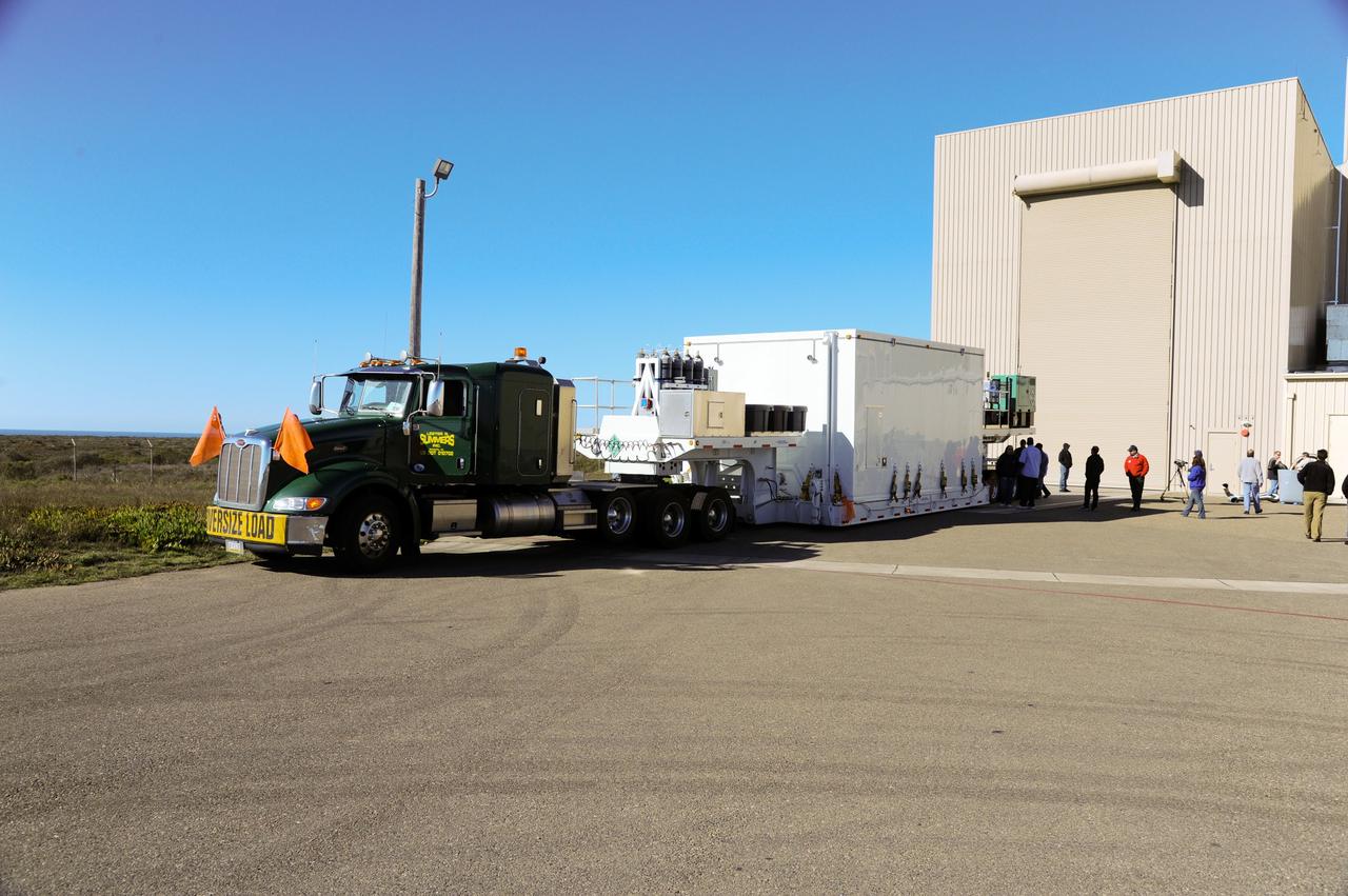 VANDENBERG AFB, Calif.-- NASA's Landsat Data Continuity Mission, or LDCM, satellite arrives by transport truck at the Vandenberg Air Force Base, Calif. for prelaunch processing.      The Landsat Data Continuity Mission LDCM is the future of Landsat satellites. It will continue to obtain valuable data and imagery to be used in agriculture, education, business, science, and government. The Landsat Program provides repetitive acquisition of high resolution multispectral data of the Earth's surface on a global basis. The data from the Landsat spacecraft constitute the longest record of the Earth's continental surfaces as seen from space. It is a record unmatched in quality, detail, coverage, and value. Launch is planned for Feb. 11, 2013. For more information, visit: http://www.nasa.gov/mission_pages/landsat/main/index.html Photo credit: NASA