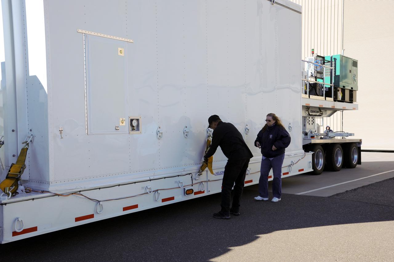 VANDENBERG AFB, Calif.-- Technicians check out the transport truck used to deliver NASA's Landsat Data Continuity Mission, or LDCM, satellite to Vandenberg Air Force Base, Calif. for prelaunch processing.      The Landsat Data Continuity Mission LDCM is the future of Landsat satellites. It will continue to obtain valuable data and imagery to be used in agriculture, education, business, science, and government. The Landsat Program provides repetitive acquisition of high resolution multispectral data of the Earth's surface on a global basis. The data from the Landsat spacecraft constitute the longest record of the Earth's continental surfaces as seen from space. It is a record unmatched in quality, detail, coverage, and value. Launch is planned for Feb. 11, 2013. For more information, visit: http://www.nasa.gov/mission_pages/landsat/main/index.html Photo credit: NASA