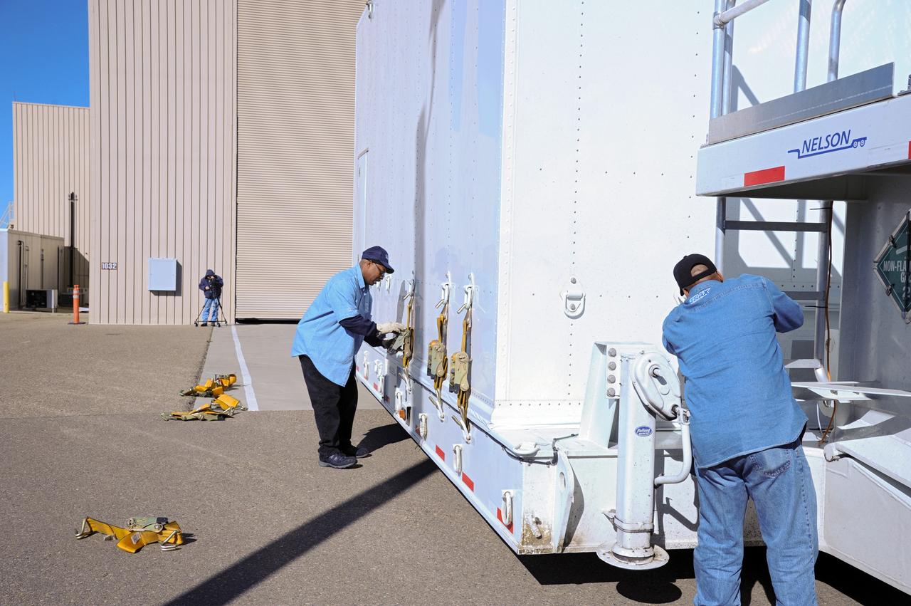 VANDENBERG AFB, Calif.-- Technicians check out the transport truck used to deliver NASA's Landsat Data Continuity Mission, or LDCM, satellite to Vandenberg Air Force Base, Calif. for prelaunch processing.      The Landsat Data Continuity Mission LDCM is the future of Landsat satellites. It will continue to obtain valuable data and imagery to be used in agriculture, education, business, science, and government. The Landsat Program provides repetitive acquisition of high resolution multispectral data of the Earth's surface on a global basis. The data from the Landsat spacecraft constitute the longest record of the Earth's continental surfaces as seen from space. It is a record unmatched in quality, detail, coverage, and value. Launch is planned for Feb. 11, 2013. For more information, visit: http://www.nasa.gov/mission_pages/landsat/main/index.html Photo credit: NASA