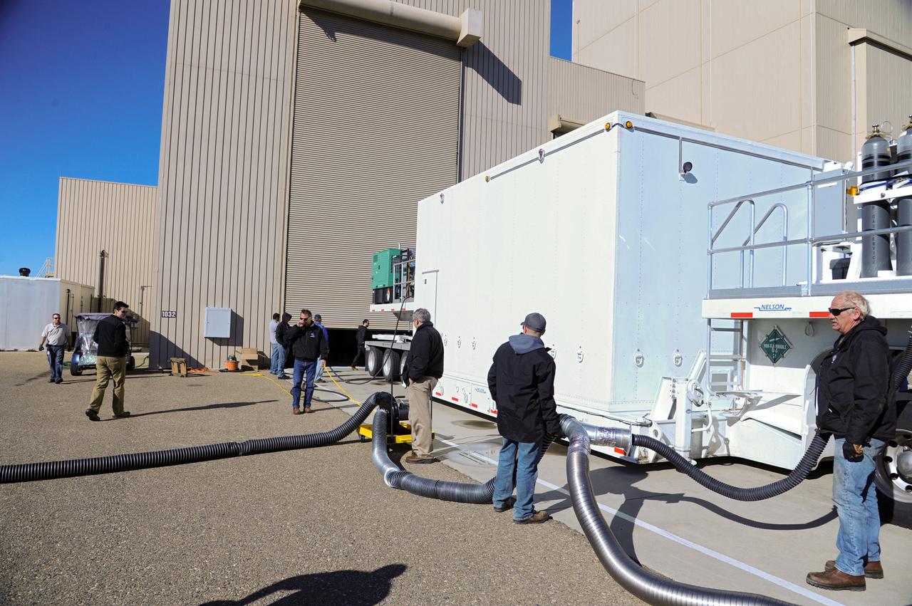 VANDENBERG AFB, Calif.-- Technicians check out the transport truck used to deliver NASA's Landsat Data Continuity Mission, or LDCM, satellite to Vandenberg Air Force Base, Calif. for prelaunch processing.      The Landsat Data Continuity Mission LDCM is the future of Landsat satellites. It will continue to obtain valuable data and imagery to be used in agriculture, education, business, science, and government. The Landsat Program provides repetitive acquisition of high resolution multispectral data of the Earth's surface on a global basis. The data from the Landsat spacecraft constitute the longest record of the Earth's continental surfaces as seen from space. It is a record unmatched in quality, detail, coverage, and value. Launch is planned for Feb. 11, 2013. For more information, visit: http://www.nasa.gov/mission_pages/landsat/main/index.html Photo credit: NASA
