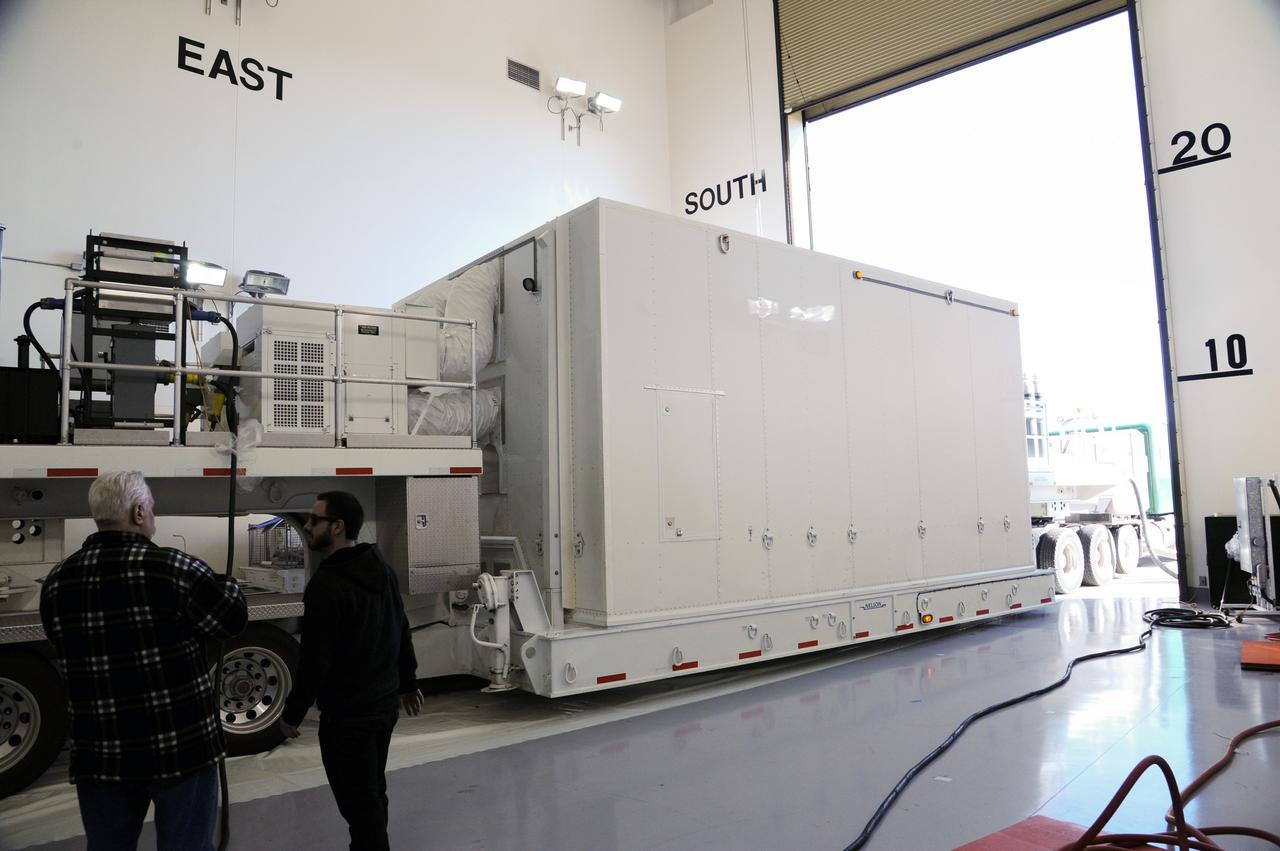 VANDENBERG AFB, Calif.-- The truck transporting NASA's Landsat Data Continuity Mission, or LDCM, satellite backs into the processing facility at Vandenberg Air Force Base, Calif. for prelaunch checkout.      The Landsat Data Continuity Mission LDCM is the future of Landsat satellites. It will continue to obtain valuable data and imagery to be used in agriculture, education, business, science, and government. The Landsat Program provides repetitive acquisition of high resolution multispectral data of the Earth's surface on a global basis. The data from the Landsat spacecraft constitute the longest record of the Earth's continental surfaces as seen from space. It is a record unmatched in quality, detail, coverage, and value. Launch is planned for Feb. 11, 2013. For more information, visit: http://www.nasa.gov/mission_pages/landsat/main/index.html Photo credit: NASA