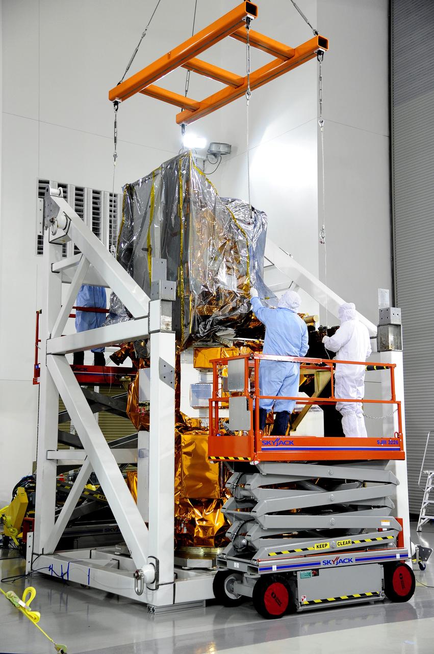 VANDENBERG AFB, Calif.-- Technicians unload NASA's Landsat Data Continuity Mission, or LDCM, satellite at the Astrotech processing facility at Vandenberg Air Force Base, Calif.      The Landsat Data Continuity Mission LDCM is the future of Landsat satellites. It will continue to obtain valuable data and imagery to be used in agriculture, education, business, science, and government. The Landsat Program provides repetitive acquisition of high resolution multispectral data of the Earth's surface on a global basis. The data from the Landsat spacecraft constitute the longest record of the Earth's continental surfaces as seen from space. It is a record unmatched in quality, detail, coverage, and value. Launch is planned for Feb. 11, 2013. For more information, visit: http://www.nasa.gov/mission_pages/landsat/main/index.html Photo credit: NASA