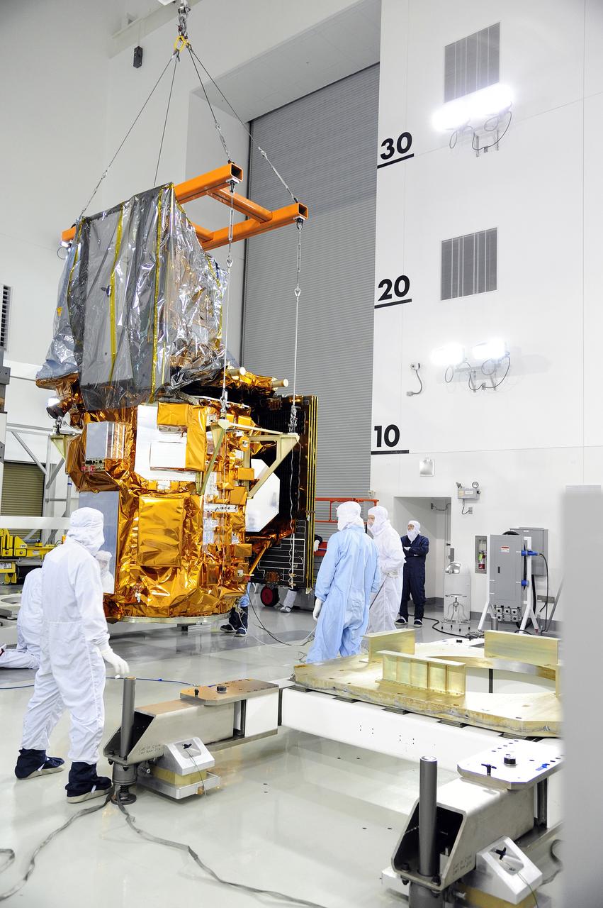 VANDENBERG AFB, Calif.-- Technicians use a crane to move NASA's Landsat Data Continuity Mission, or LDCM, satellite at the Astrotech processing facility at Vandenberg Air Force Base, Calif.      The Landsat Data Continuity Mission LDCM is the future of Landsat satellites. It will continue to obtain valuable data and imagery to be used in agriculture, education, business, science, and government. The Landsat Program provides repetitive acquisition of high resolution multispectral data of the Earth's surface on a global basis. The data from the Landsat spacecraft constitute the longest record of the Earth's continental surfaces as seen from space. It is a record unmatched in quality, detail, coverage, and value. Launch is planned for Feb. 11, 2013. For more information, visit: http://www.nasa.gov/mission_pages/landsat/main/index.html Photo credit: NASA