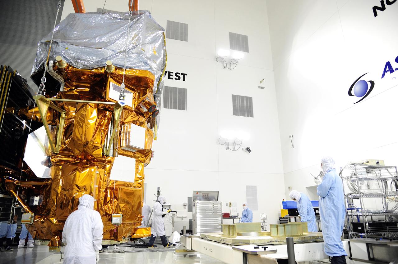 VANDENBERG AFB, Calif.-- Technicians begin checkout of NASA's Landsat Data Continuity Mission, or LDCM, satellite at the Astrotech processing facility at Vandenberg Air Force Base, Calif.      The Landsat Data Continuity Mission LDCM is the future of Landsat satellites. It will continue to obtain valuable data and imagery to be used in agriculture, education, business, science, and government. The Landsat Program provides repetitive acquisition of high resolution multispectral data of the Earth's surface on a global basis. The data from the Landsat spacecraft constitute the longest record of the Earth's continental surfaces as seen from space. It is a record unmatched in quality, detail, coverage, and value. Launch is planned for Feb. 11, 2013. For more information, visit: http://www.nasa.gov/mission_pages/landsat/main/index.html Photo credit: NASA