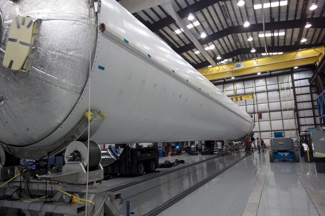 CAPE CANAVERAL, Fla. – The first stage of the Falcon 9 rocket is placed in a workstand inside the SpaceX Falcon Hangar at Launch Complex 40 on Cape Canaveral Air Force Station in Florida.      The two-stage rocket will launch the company's Dragon spacecraft on the upcoming SpaceX CRS-2 mission. The flight will be the second commercial resupply mission to the International Space Station by Space Exploration Technologies, or SpaceX. NASA has contracted for a total of 12 commercial resupply flights from SpaceX and eight from the Orbital Sciences Corp. Photo credit: NASA/Jim Grossmann