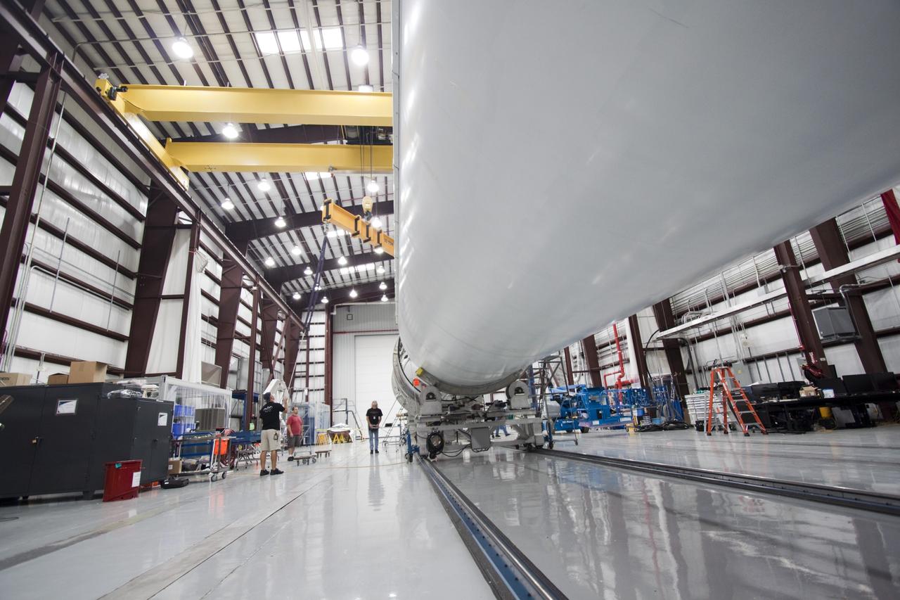 CAPE CANAVERAL, Fla. – Inside the SpaceX Falcon Hangar at Launch Complex 40 on Cape Canaveral Air Force Station in Florida, the first stage of the Falcon 9 rocket is placed in a workstand for prelaunch processing.       The two-stage rocket will launch the company's Dragon spacecraft on the upcoming SpaceX CRS-2 mission. The flight will be the second commercial resupply mission to the International Space Station by Space Exploration Technologies, or SpaceX. NASA has contracted for a total of 12 commercial resupply flights from SpaceX and eight from the Orbital Sciences Corp. Photo credit: NASA/Jim Grossmann