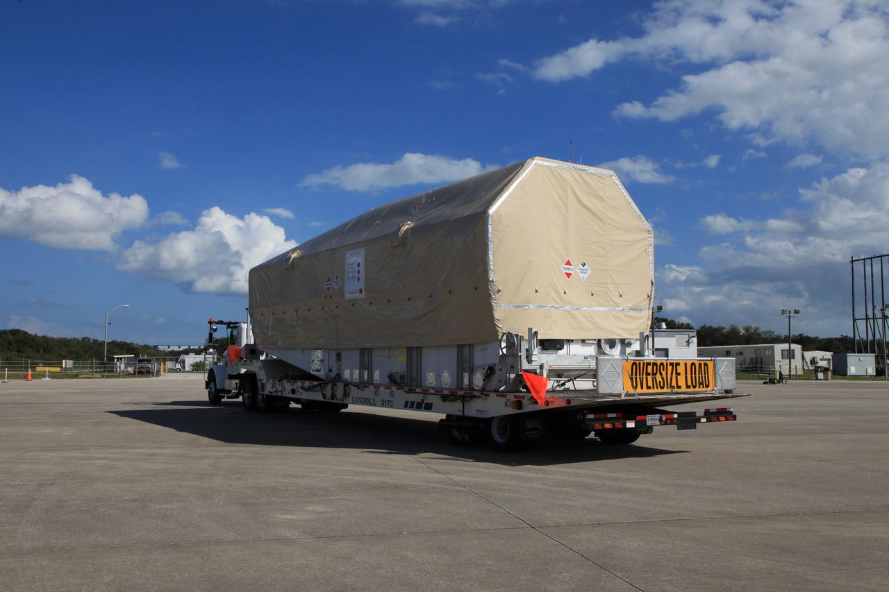 CAPE CANAVERAL, Fla. - A truck transporting the Tracking and Data Relay Satellite, TDRS-K, departs from the Shuttle Landing Facility at NASA's Kennedy Space Center in Florida.      Launch of the TDRS-K on the Atlas V rocket is planned for January 29, 2013. The TDRS-K spacecraft is part of the next-generation series in the Tracking and Data Relay Satellite System, a constellation of space-based communication satellites providing tracking, telemetry, command and high-bandwidth data return services. For more information, visit http://www.nasa.gov/mission_pages/tdrs/index.html Photo credit: NASA/Kim Shiflett