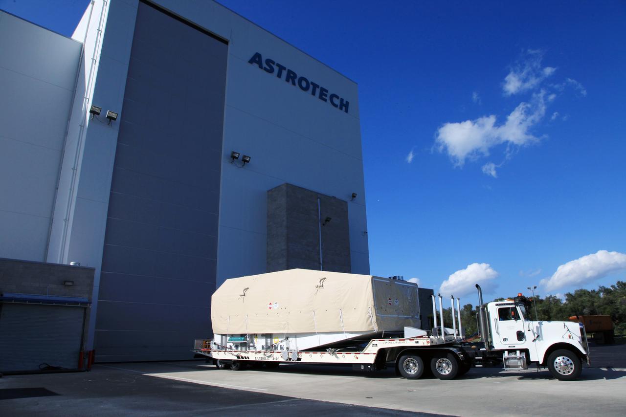 TITUSVILLE, Fla. - A truck transporting the Tracking and Data Relay Satellite, TDRS-K, arrives at the Astrotech payload processing facility in Titusville, Fla. near NASA’s Kennedy Space Center.      Launch of the TDRS-K on the Atlas V rocket is planned for January 29, 2013. The TDRS-K spacecraft is part of the next-generation series in the Tracking and Data Relay Satellite System, a constellation of space-based communication satellites providing tracking, telemetry, command and high-bandwidth data return services. For more information, visit http://www.nasa.gov/mission_pages/tdrs/index.html Photo credit: NASA/Kim Shiflett