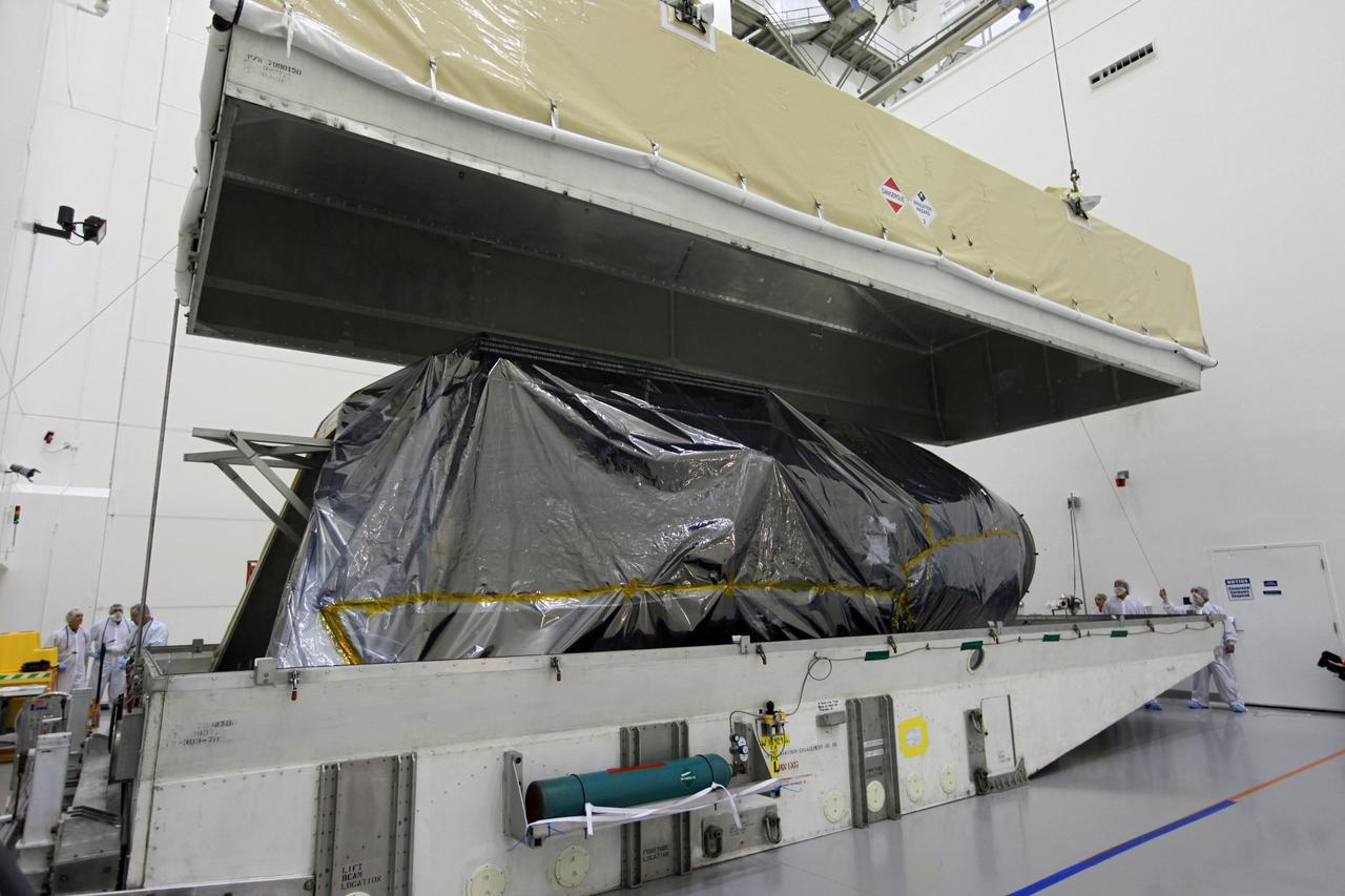 TITUSVILLE, Fla. - Technicians unpack the Tracking and Data Relay Satellite, TDRS-K, after arrival at the Astrotech payload processing facility in Titusville, Fla. near NASA’s Kennedy Space Center.      Launch of the TDRS-K on the Atlas V rocket is planned for January 29, 2013. The TDRS-K spacecraft is part of the next-generation series in the Tracking and Data Relay Satellite System, a constellation of space-based communication satellites providing tracking, telemetry, command and high-bandwidth data return services. For more information, visit http://www.nasa.gov/mission_pages/tdrs/index.html Photo credit: NASA/Kim Shiflett