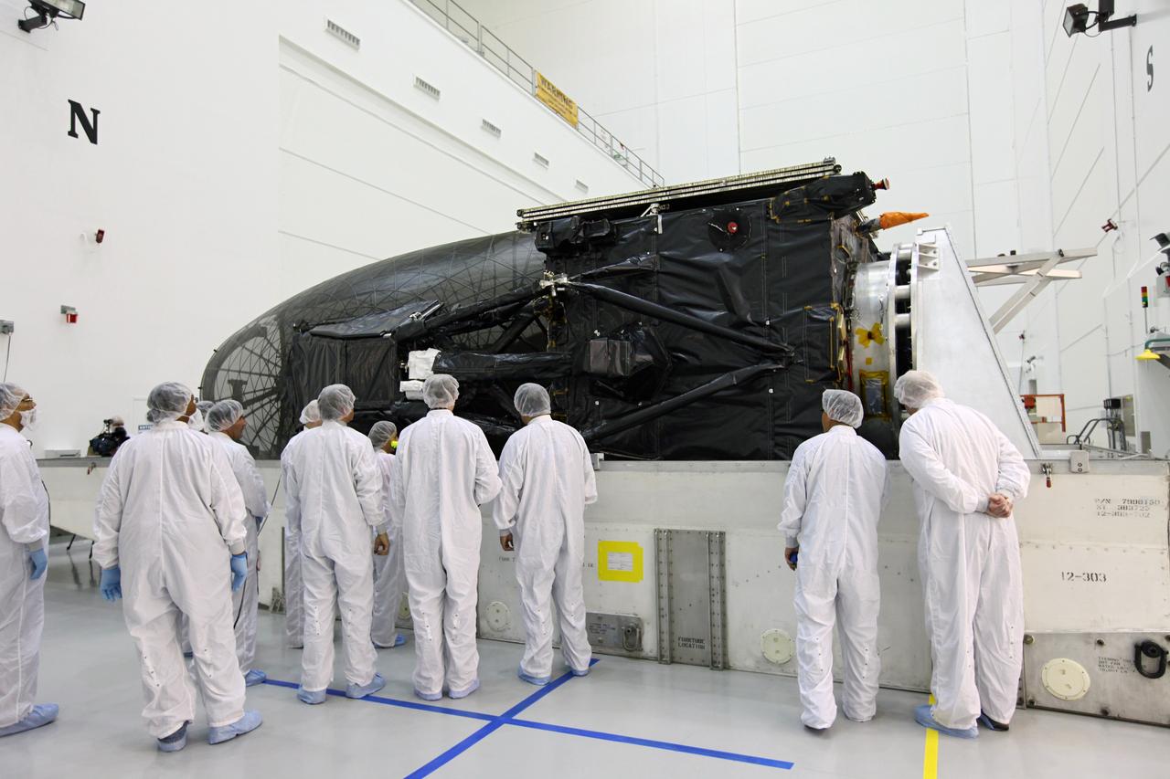 TITUSVILLE, Fla. - Technicians inspect the Tracking and Data Relay Satellite, TDRS-K, after arrival at the Astrotech payload processing facility in Titusville, Fla. near NASA’s Kennedy Space Center.      Launch of the TDRS-K on the Atlas V rocket is planned for January 29, 2013. The TDRS-K spacecraft is part of the next-generation series in the Tracking and Data Relay Satellite System, a constellation of space-based communication satellites providing tracking, telemetry, command and high-bandwidth data return services. For more information, visit http://www.nasa.gov/mission_pages/tdrs/index.html Photo credit: NASA/Kim Shiflett