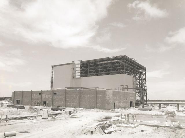 View of OPF High Bay No. 1 and Low Bay construction, 1976