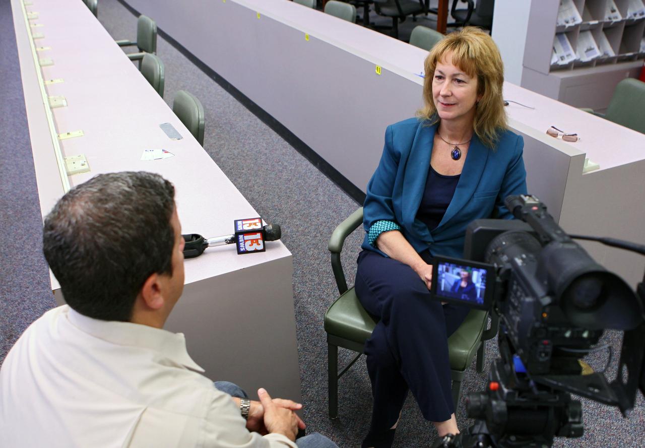 CAPE CANAVERAL, Fla. -- To start the new year, Joyce M. Riquelme from Kennedy's Center Planning and Development Office discusses the space center's direction with TV news reporter Greg Pallone of Channel 13 in Orlando.The office's purpose is to develop the world’s premier spaceport, meeting government and commercial space industry needs through comprehensive resource planning and the formation of partnerships to ensure the economic vitality of Kennedy Space Center. Photo credit: NASA/Kim Shiflett