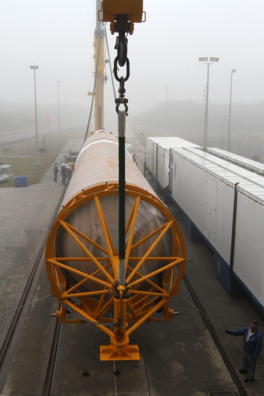 CAPE CANAVERAL, Fla. -- In the morning fog at Cape Canaveral Air Force Station's Space Launch Complex 41 in Florida, preparations are underway to erect the first stage of the Atlas V rocket that will carry the Tracking and Data Relay Satellite, TDRS-K, into orbit.      Launch of the TDRS-K on the Atlas V rocket is planned for January 29, 2013. The TDRS-K spacecraft is part of the next-generation series in the Tracking and Data Relay Satellite System, a constellation of space-based communication satellites providing tracking, telemetry, command and high-bandwidth data return services. For more information, visit http://www.nasa.gov/mission_pages/tdrs/index.html Photo credit: NASA/ Ben Smegelsky