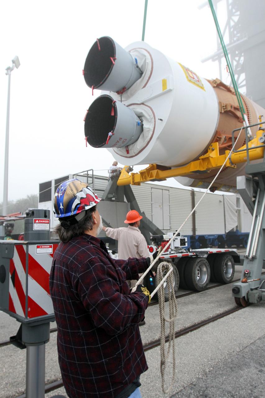 CAPE CANAVERAL, Fla. -- At Cape Canaveral Air Force Station's Space Launch Complex 41 in Florida, United Launch Alliance technicians support operations to erect the first stage of the Atlas V rocket that will carry the Tracking and Data Relay Satellite, TDRS-K, into orbit.      Launch of the TDRS-K on the Atlas V rocket is planned for January 29, 2013. The TDRS-K spacecraft is part of the next-generation series in the Tracking and Data Relay Satellite System, a constellation of space-based communication satellites providing tracking, telemetry, command and high-bandwidth data return services. For more information, visit http://www.nasa.gov/mission_pages/tdrs/index.html Photo credit: NASA/ Ben Smegelsky