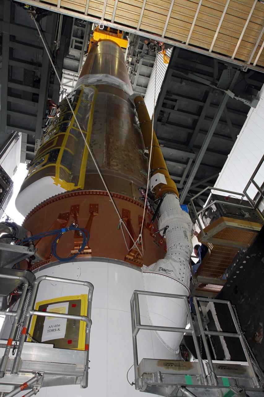 CAPE CANAVERAL, Fla. -- At Cape Canaveral Air Force Station's Space Launch Complex 41 in Florida, operations are underway to erect the first stage of the Atlas V rocket that will carry the Tracking and Data Relay Satellite, TDRS-K, into orbit.      Launch of the TDRS-K on the Atlas V rocket is planned for January 29, 2013. The TDRS-K spacecraft is part of the next-generation series in the Tracking and Data Relay Satellite System, a constellation of space-based communication satellites providing tracking, telemetry, command and high-bandwidth data return services. For more information, visit http://www.nasa.gov/mission_pages/tdrs/index.html Photo credit: NASA/ Ben Smegelsky