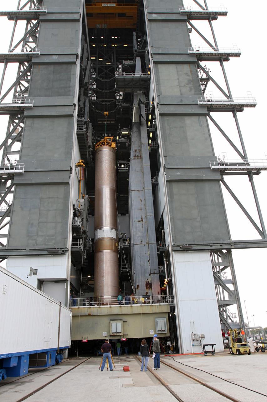 CAPE CANAVERAL, Fla. -- At Cape Canaveral Air Force Station's Space Launch Complex 41 in Florida, United Launch Alliance technicians support operations to erect the first stage of the Atlas V rocket that will carry the Tracking and Data Relay Satellite, TDRS-K, into orbit.      Launch of the TDRS-K on the Atlas V rocket is planned for January 29, 2013. The TDRS-K spacecraft is part of the next-generation series in the Tracking and Data Relay Satellite System, a constellation of space-based communication satellites providing tracking, telemetry, command and high-bandwidth data return services. For more information, visit http://www.nasa.gov/mission_pages/tdrs/index.html Photo credit: NASA/ Ben Smegelsky