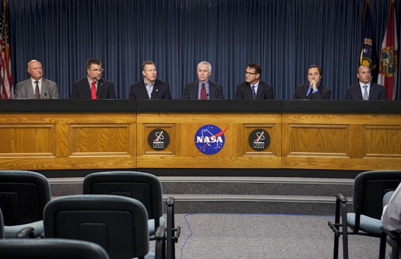 CAPE CANAVERAL, Fla. -- At a news conference NASA officials and industry partners discuss progress of the agency's Commercial Crew Program CCP. Participating in the briefing, from the left are, Mike Curie, NASA Public Affairs, Ed Mango, NASA Commercial Crew Program manager, Phil McAlister, NASA Commercial Spaceflight Development director, Rob Meyerson, Blue Origin president and program manager, John Mulholland, The Boeing Company Commercial Programs Space Exploration vice president and program manager, Mark Sirangelo, Sierra Nevada Corp. vice president and SNC Space Systems chairman and Garrett Reisman, Space Exploration Technologies SpaceX Commercial Crew project manager. Through CCP, NASA is facilitating the development of U.S. commercial crew space transportation capabilities to achieve safe, reliable and cost-effective access to and from low-Earth orbit for potential future government and commercial customers. For more information, visit http://www.nasa.gov/commercialcrew Photo credit: NASA/Kim Shiflett