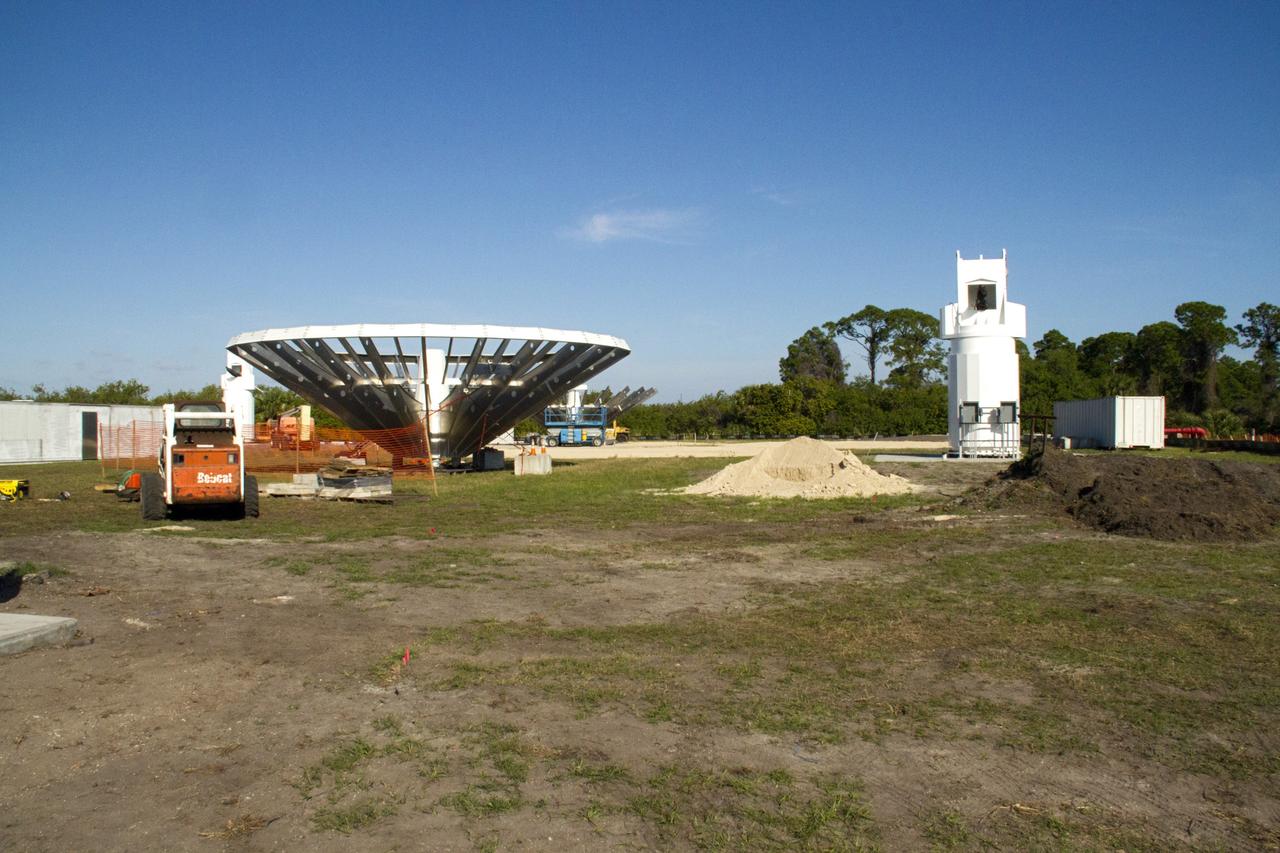 CAPE CANAVERAL, Fla. – At NASA’s Kennedy Space Center in Florida, 40-foot-diameter dish antenna arrays are being constructed as part of the Antenna Test Bed Array for the Ka-Band Objects Observation and Monitoring, or Ka-BOOM system. The antennas will be part of the operations command center facility. The construction site is near the former Vertical Processing Facility, which has been demolished. The Ka-BOOM project is one of the final steps in developing the techniques to build a high power, high resolution radar system capable of becoming a Near Earth Object Early Warning System. While also capable of space communication and radio science experiments, developing radar applications is the primary focus of the arrays. Photo credit: NASA/ Ben Smegelsky