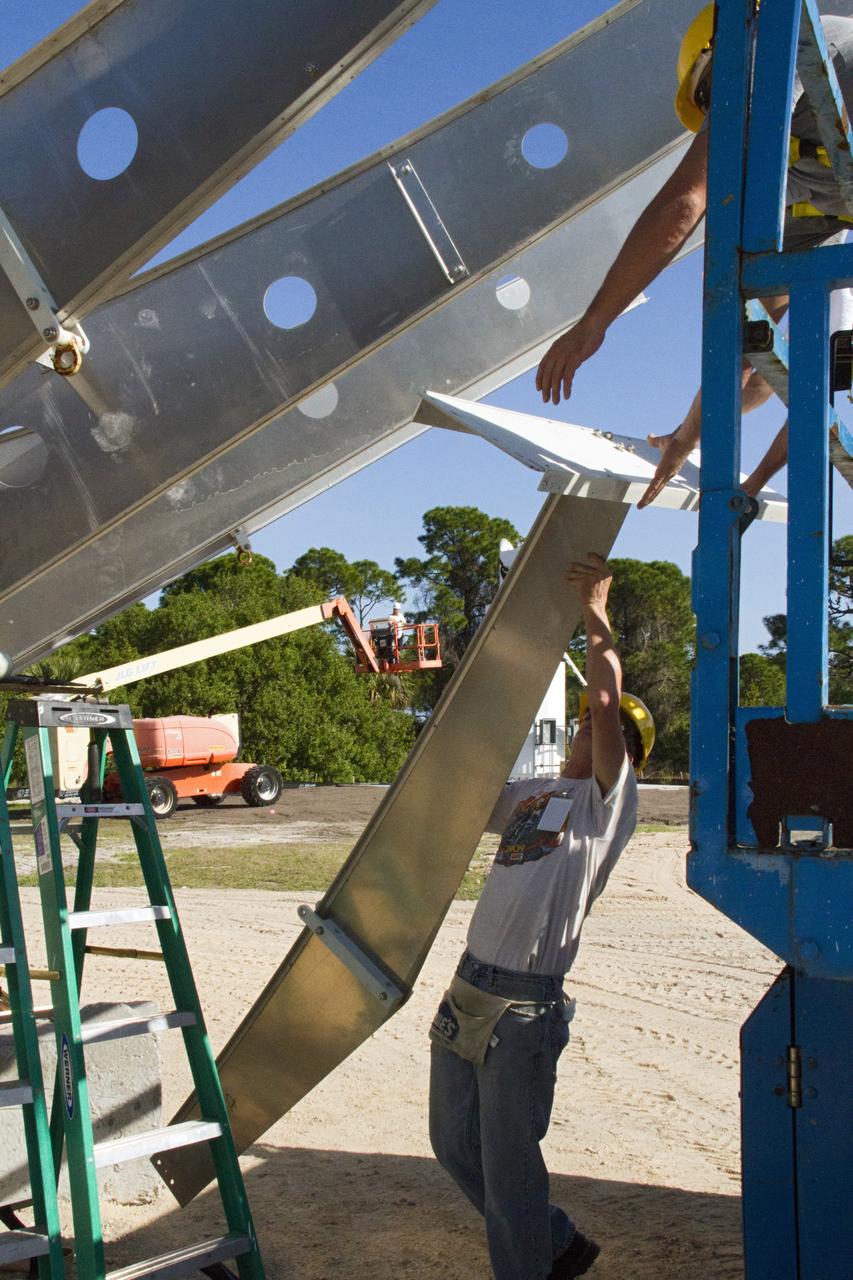 CAPE CANAVERAL, Fla. – At NASA’s Kennedy Space Center in Florida, workers are constructing 40-foot-diameter dish antenna arrays for the Ka-Band Objects Observation and Monitoring, or Ka-BOOM system. The antennas will be part of the operations command center facility. The construction site is near the former Vertical Processing Facility, which has been demolished. The Ka-BOOM project is one of the final steps in developing the techniques to build a high power, high resolution radar system capable of becoming a Near Earth Object Early Warning System. While also capable of space communication and radio science experiments, developing radar applications is the primary focus of the arrays. Photo credit: NASA/ Ben Smegelsky