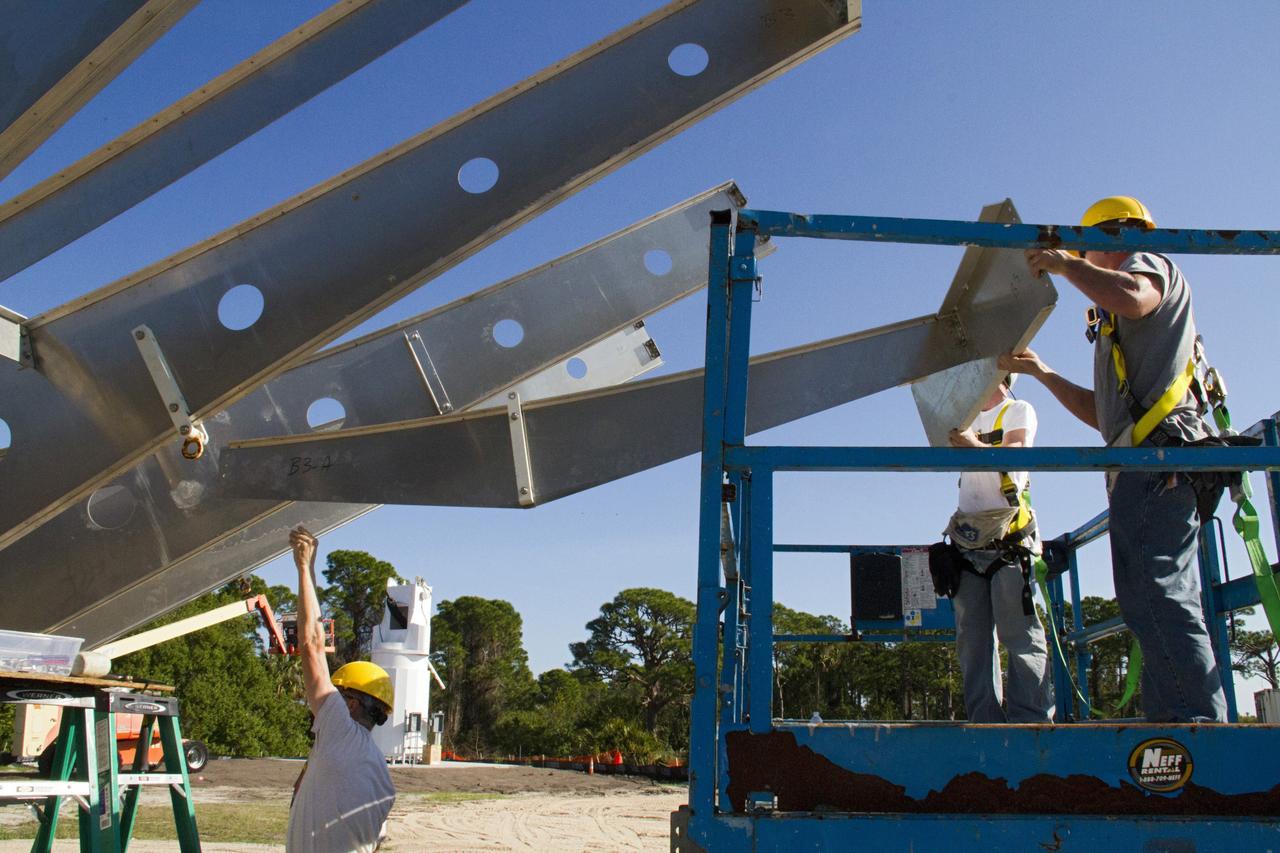 CAPE CANAVERAL, Fla. – At NASA’s Kennedy Space Center in Florida, workers are constructing 40-foot-diameter dish antenna arrays for the Ka-Band Objects Observation and Monitoring, or Ka-BOOM system. The antennas will be part of the operations command center facility. The construction site is near the former Vertical Processing Facility, which has been demolished. The Ka-BOOM project is one of the final steps in developing the techniques to build a high power, high resolution radar system capable of becoming a Near Earth Object Early Warning System. While also capable of space communication and radio science experiments, developing radar applications is the primary focus of the arrays. Photo credit: NASA/ Ben Smegelsky