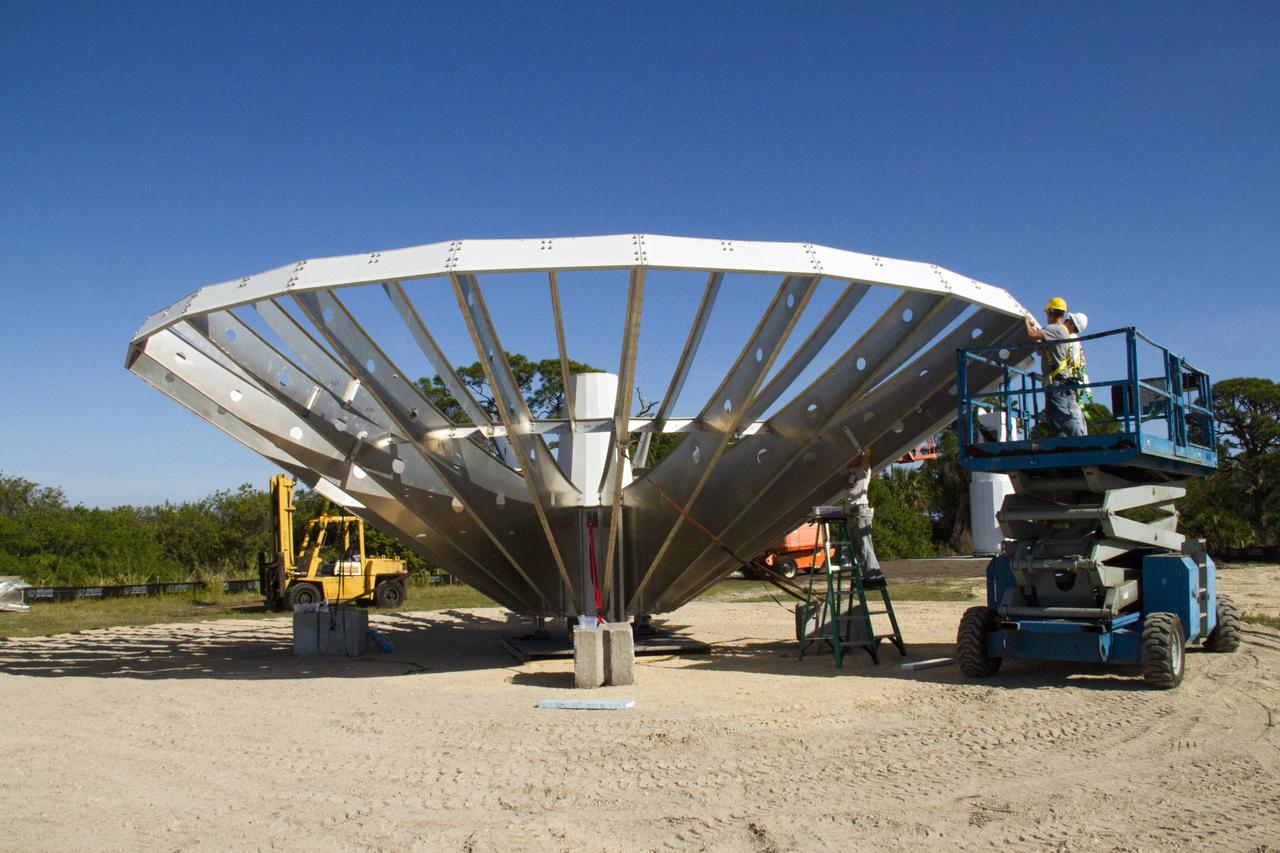 CAPE CANAVERAL, Fla. – At NASA’s Kennedy Space Center in Florida, workers are constructing 40-foot-diameter dish antenna arrays for the Ka-Band Objects Observation and Monitoring, or Ka-BOOM system. The antennas will be part of the operations command center facility. The construction site is near the former Vertical Processing Facility, which has been demolished. The Ka-BOOM project is one of the final steps in developing the techniques to build a high power, high resolution radar system capable of becoming a Near Earth Object Early Warning System. While also capable of space communication and radio science experiments, developing radar applications is the primary focus of the arrays. Photo credit: NASA/ Ben Smegelsky