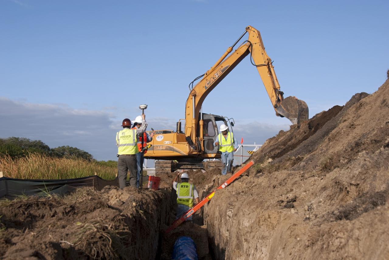 CAPE CANAVERAL, Fla. – At NASA’s Kennedy Space Center in Florida, a new 12-inch water main is being installed as part of a water/wastewater revitalizing plan. The main will provide water to the area around the shuttle landing facility's Landing Aids Control Building and fire station. NASA’s space shuttle runway is a unique national asset designed to enable the recovery of the agency’s fleet of space shuttle orbiters. The shuttle landing facility is a single, 15,000-foot long concrete runway oriented to the southeast and northwest. Air traffic control is provided from a control tower built to FAA standards. Fire and emergency response services are also available from an onsite facility. For more information, visit http://kscpartnerships.ksc.nasa.gov/slf.htm Photo credit: NASA/Tim Jacobs