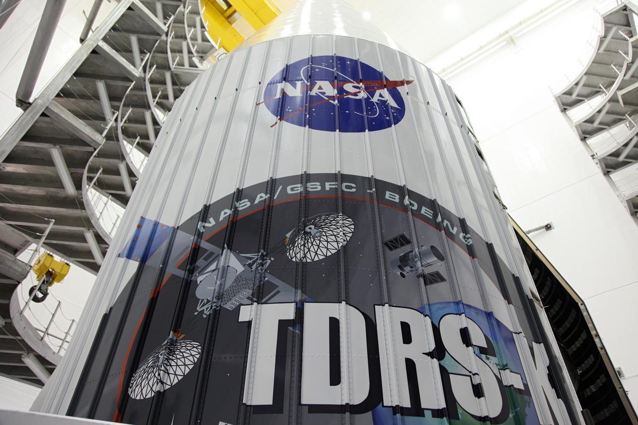 TITUSVILLE, Fla. – A closer look at the logo painted on one half of the payload fairing that will protect NASA's Tracking and Data Relay Satellite, TDRS-K, inside the Astrotech payload processing facility in Titusville, Fla., near NASA’s Kennedy Space Center. Launch of the TDRS-K on a United Launch Alliance Atlas V rocket is planned for January 29, 2013. The TDRS-K spacecraft is part of the next-generation series in the Tracking and Data Relay Satellite System, a constellation of space-based communication satellites providing tracking, telemetry, command and high-bandwidth data return services. Photo credit: NASA/Frankie Martin