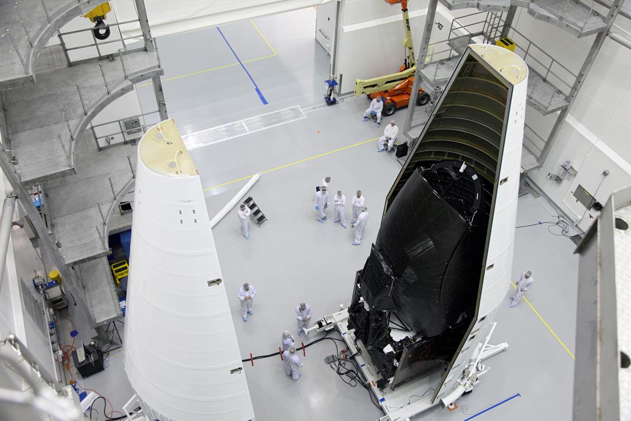 TITUSVILLE, Fla. – NASA's Tracking and Data Relay Satellite, TDRS-K, stands inside one half of the payload fairing as the spacecraft is encapsulated inside the Astrotech payload processing facility in Titusville, Fla., near NASA’s Kennedy Space Center. Launch of the TDRS-K on a United Launch Alliance Atlas V rocket is planned for January 29, 2013. The TDRS-K spacecraft is part of the next-generation series in the Tracking and Data Relay Satellite System, a constellation of space-based communication satellites providing tracking, telemetry, command and high-bandwidth data return services. Photo credit: NASA/Frankie Martin