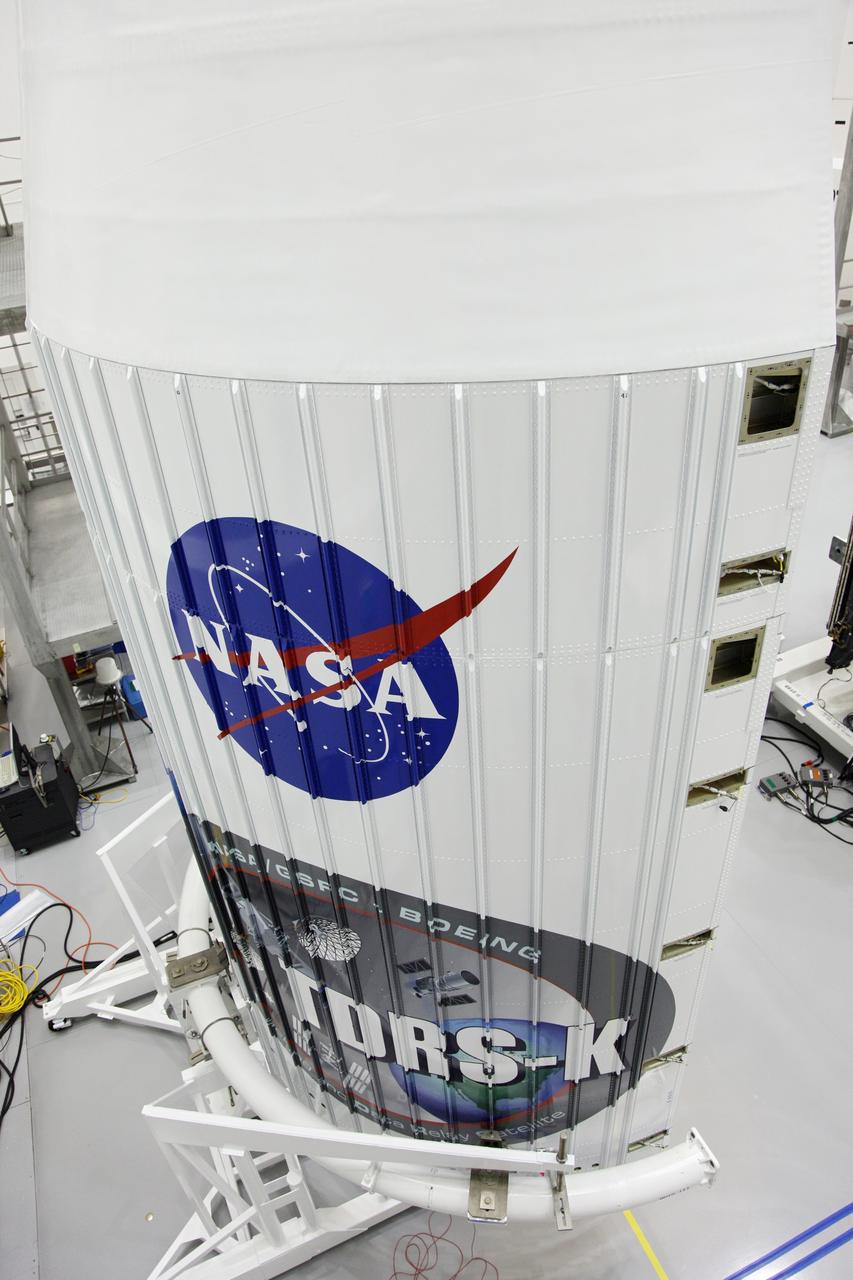 TITUSVILLE, Fla. – A closer look at the logo painted on one half of the payload fairing that will protect NASA's Tracking and Data Relay Satellite, TDRS-K, inside the Astrotech payload processing facility in Titusville, Fla., near NASA’s Kennedy Space Center. Launch of the TDRS-K on a United Launch Alliance Atlas V rocket is planned for January 29, 2013. The TDRS-K spacecraft is part of the next-generation series in the Tracking and Data Relay Satellite System, a constellation of space-based communication satellites providing tracking, telemetry, command and high-bandwidth data return services. Photo credit: NASA/Frankie Martin