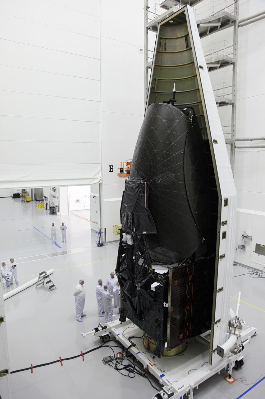 TITUSVILLE, Fla. –NASA's Tracking and Data Relay Satellite, TDRS-K, stands inside one half of the payload fairing as the spacecraft is encapsulated inside the Astrotech payload processing facility in Titusville, Fla., near NASA’s Kennedy Space Center. Launch of the TDRS-K on a United Launch Alliance Atlas V rocket is planned for January 29, 2013. The TDRS-K spacecraft is part of the next-generation series in the Tracking and Data Relay Satellite System, a constellation of space-based communication satellites providing tracking, telemetry, command and high-bandwidth data return services. Photo credit: NASA/Frankie Martin