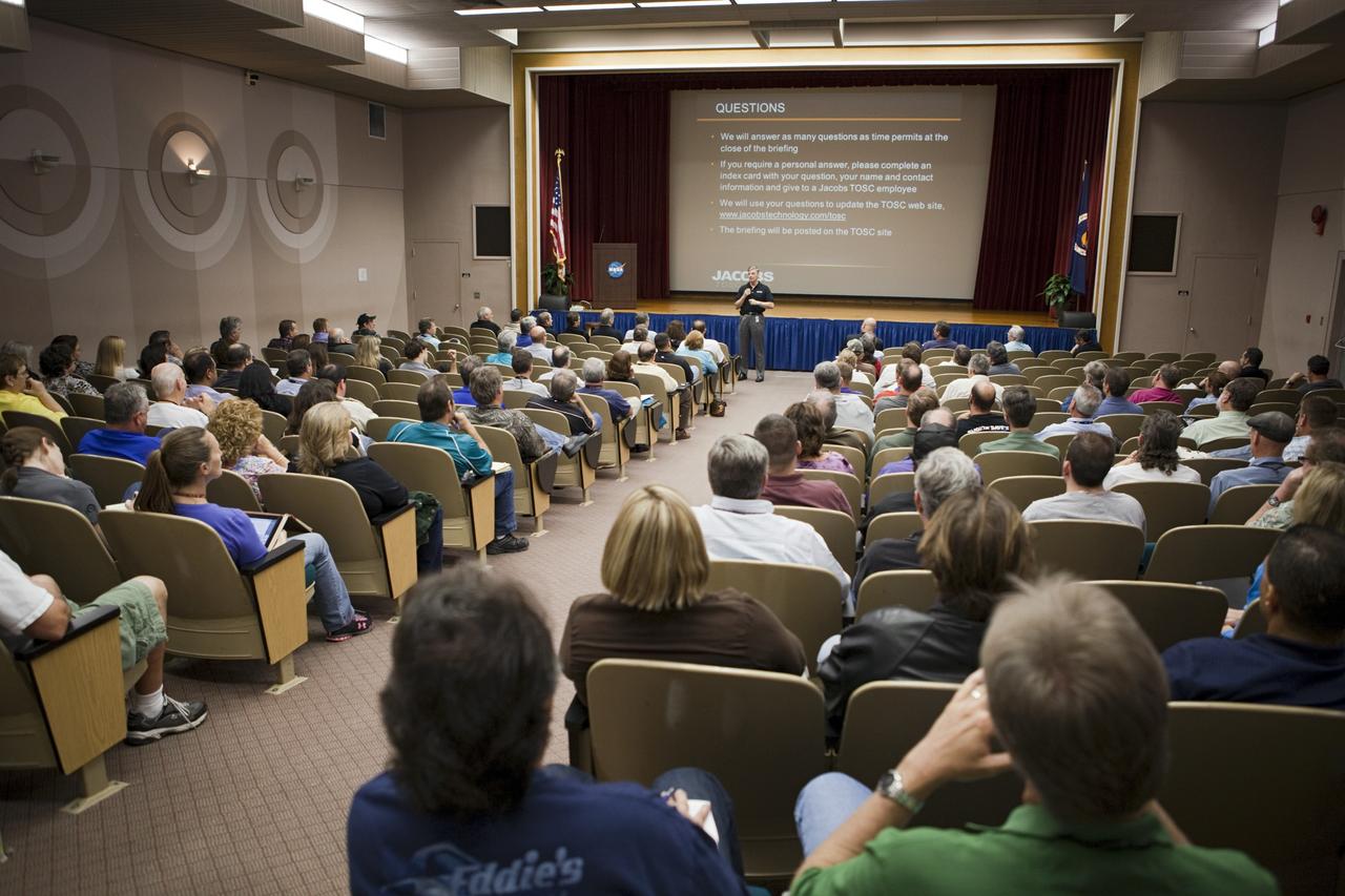 CAPE CANAVERAL, Fla. - At NASA's Kennedy Space Center in Florida, Jacobs Technology General Manager Andy Allen speaks at a town hall meeting providing attendees an opportunity to learn about the Test and Operations Support Contract, or TOSC, hiring process and to introduce the organization's management team.      NASA recently awarded its TOSC contract to Jacobs Technology Inc. of Tullahoma, Tenn. Jacobs will provide overall management and implementation of ground systems capabilities, flight hardware processing and launch operations at Kennedy. These tasks will support the International Space Station, Ground Systems Development and Operations, and the Space Launch System, Orion Multi-Purpose Crew Vehicle and Launch Services programs. For more information, visit http://www.nasa.gov/centers/kennedy/news/tosc_awarded.html Photo credit: NASA/Dimitri Gerondidakis