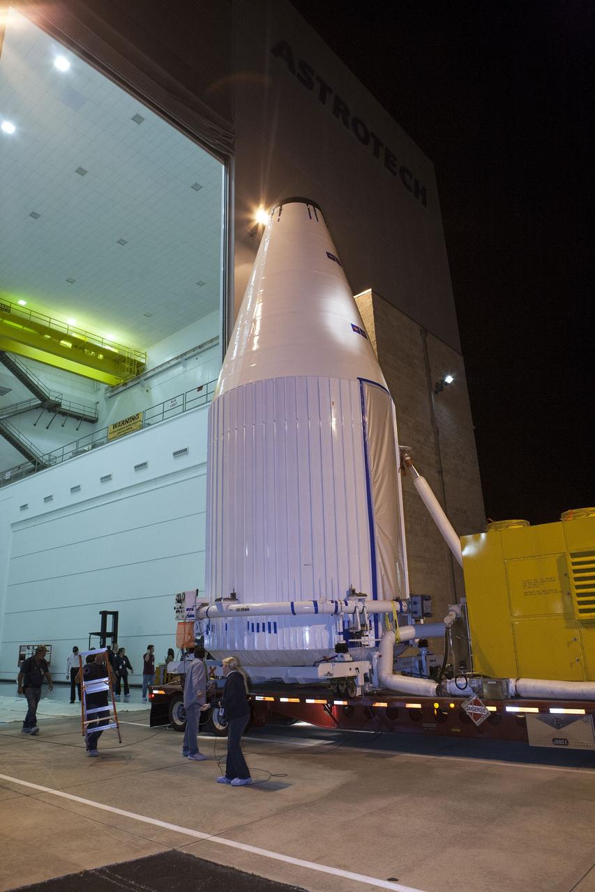 CAPE CANAVERAL, Fla. – A transporter begins moving NASA's Tracking and Data Relay Satellite, TDRS-K, enclosed in its payload fairing, from the Astrotech payload processing facility in Titusville, Fla., to its launch site. TDRS-K will lift off atop a United Launch Alliance Atlas V rocket from Cape Canaveral Air Force Station's Space Launch Complex 41, near NASA's Kennedy Space Center. The TDRS-K spacecraft is part of the next-generation series in the Tracking and Data Relay Satellite System, a constellation of space-based communication satellites providing tracking, telemetry, command and high-bandwidth data return services. For more information, go to http://www.nasa.gov/tdrs Photo credit: NASA/Glenn Benson