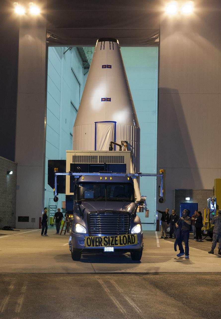 CAPE CANAVERAL, Fla. – A transporter begins moving NASA's Tracking and Data Relay Satellite, TDRS-K, enclosed in its payload fairing, from the Astrotech payload processing facility in Titusville, Fla., to its launch site. TDRS-K will lift off atop a United Launch Alliance Atlas V rocket from Cape Canaveral Air Force Station's Space Launch Complex 41, near NASA's Kennedy Space Center. The TDRS-K spacecraft is part of the next-generation series in the Tracking and Data Relay Satellite System, a constellation of space-based communication satellites providing tracking, telemetry, command and high-bandwidth data return services. For more information, go to http://www.nasa.gov/tdrs Photo credit: NASA/Glenn Benson