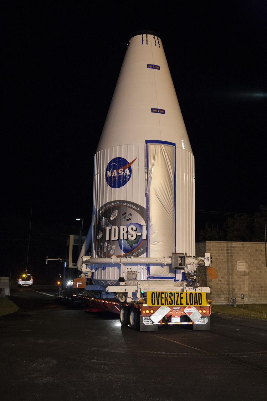 CAPE CANAVERAL, Fla. –NASA's Tracking and Data Relay Satellite, TDRS-K, enclosed in its payload fairing, enters a NASA Kennedy Space Center gate as it travels from the Astrotech payload processing facility in Titusville, Fla., to its launch site. TDRS-K will lift off atop a United Launch Alliance Atlas V rocket from Cape Canaveral Air Force Station's Space Launch Complex 41. The TDRS-K spacecraft is part of the next-generation series in the Tracking and Data Relay Satellite System, a constellation of space-based communication satellites providing tracking, telemetry, command and high-bandwidth data return services. For more information, go to http://www.nasa.gov/tdrs Photo credit: NASA/Glenn Benson