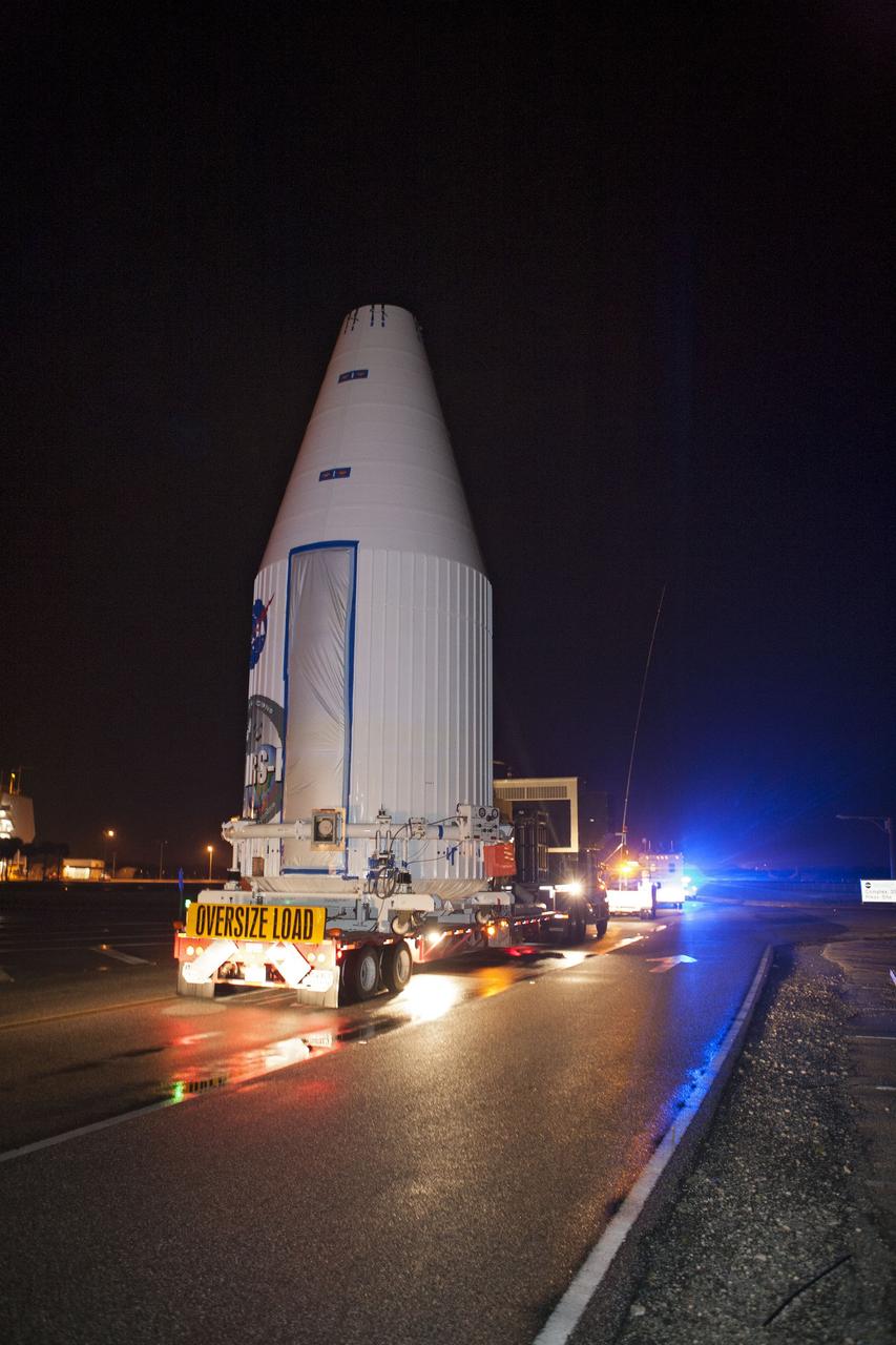 CAPE CANAVERAL, Fla. –NASA's Tracking and Data Relay Satellite, TDRS-K, enclosed in its payload fairing, passes through the Launch Complex 39 area and Press Site at NASA's Kennedy Space Center as it travels from the Astrotech payload processing facility in Titusville, Fla., to its launch site. TDRS-K will lift off atop a United Launch Alliance Atlas V rocket from Cape Canaveral Air Force Station's Space Launch Complex 41. The TDRS-K spacecraft is part of the next-generation series in the Tracking and Data Relay Satellite System, a constellation of space-based communication satellites providing tracking, telemetry, command and high-bandwidth data return services. For more information, go to http://www.nasa.gov/tdrs Photo credit: NASA/Glenn Benson